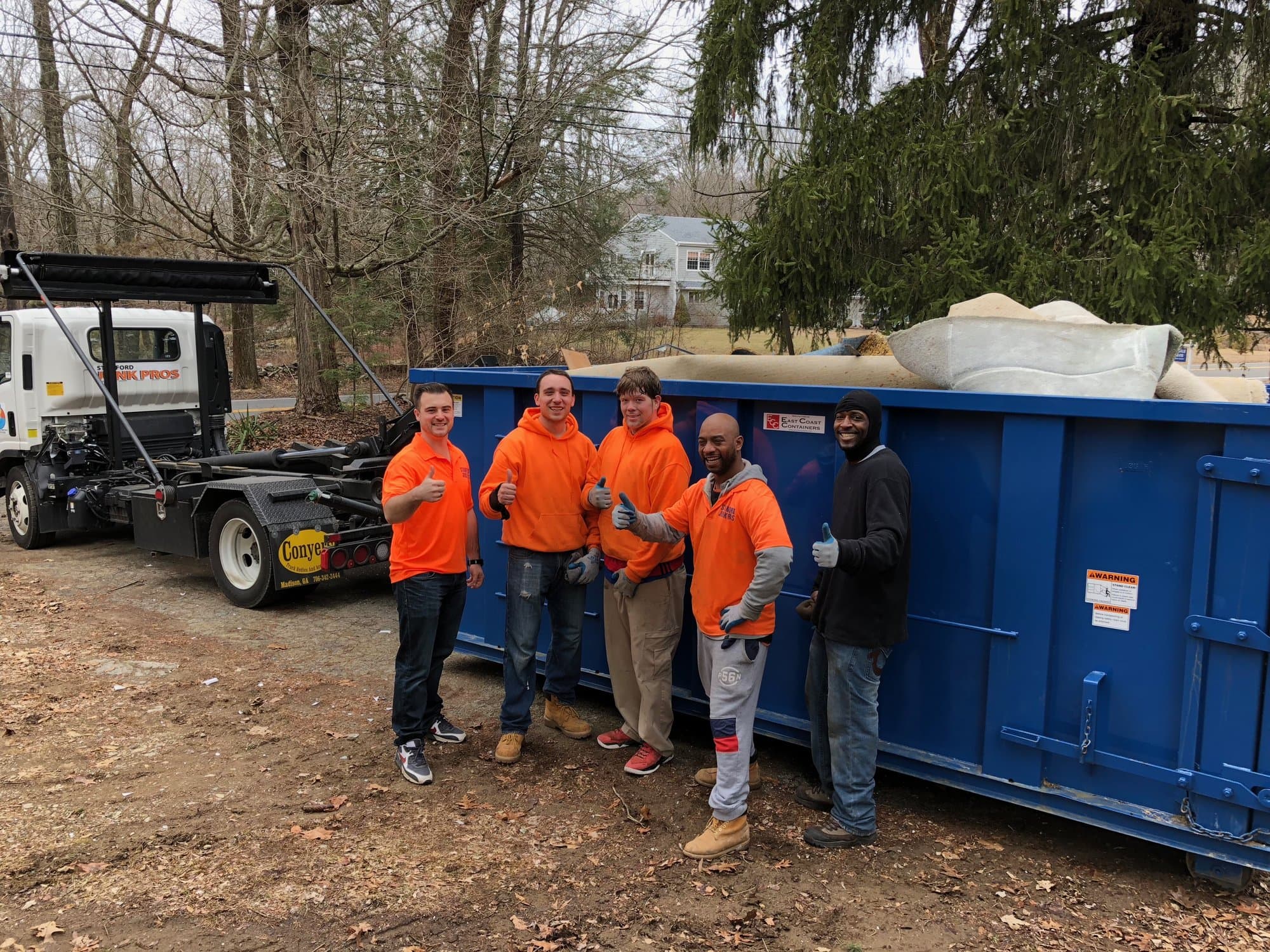 Grizzly Junk Pros truck on a residential junk-removal job