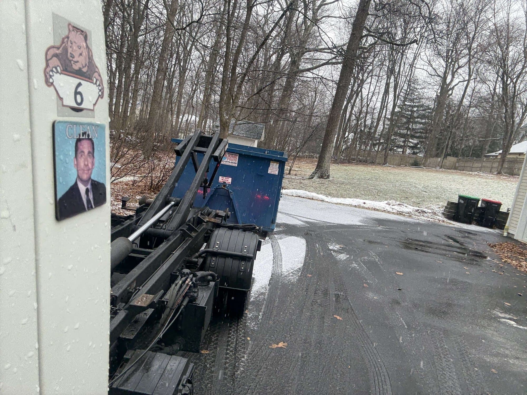 dumpster-truck-loading in Darien, CT by Grizzly Junk Pros