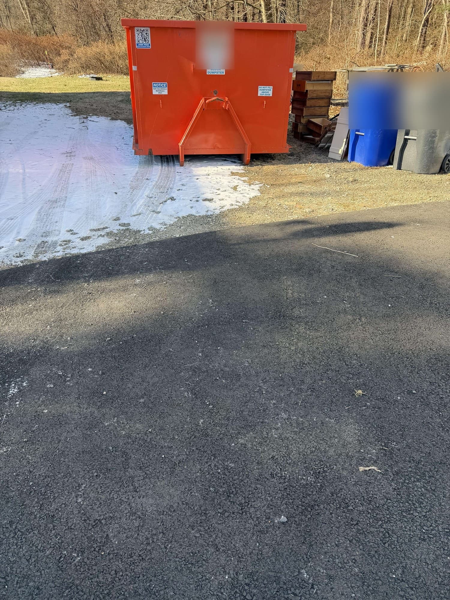 red dumpster placement in Litchfield, CT by Grizzly Junk Pros