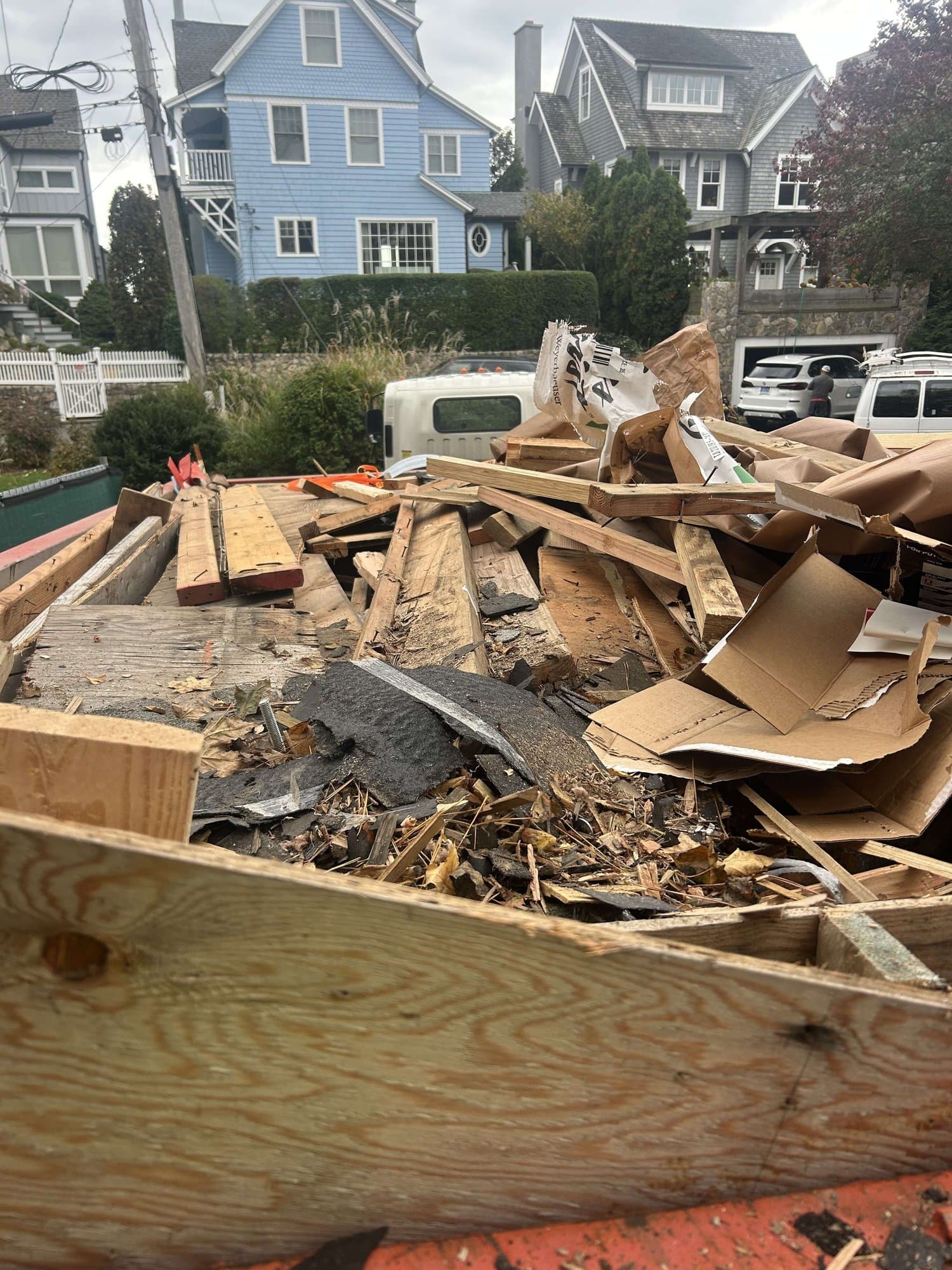 dumpster-with-construction-debris in Norwalk, CT by Stamford Junk Pros