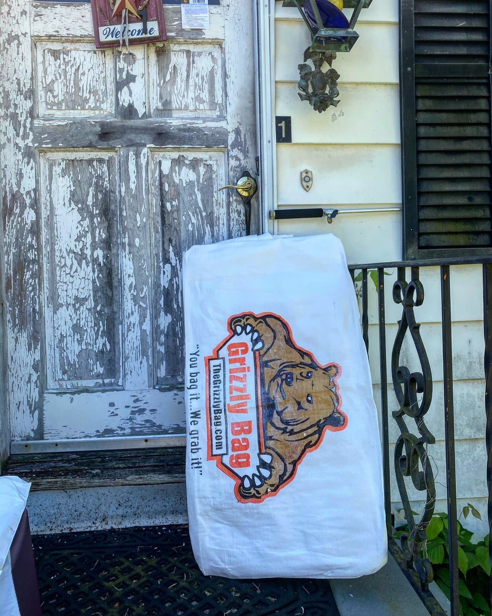 Wrapped mattress being cleared from a residential property in Norwalk, CT by Grizzly Junk Pros
