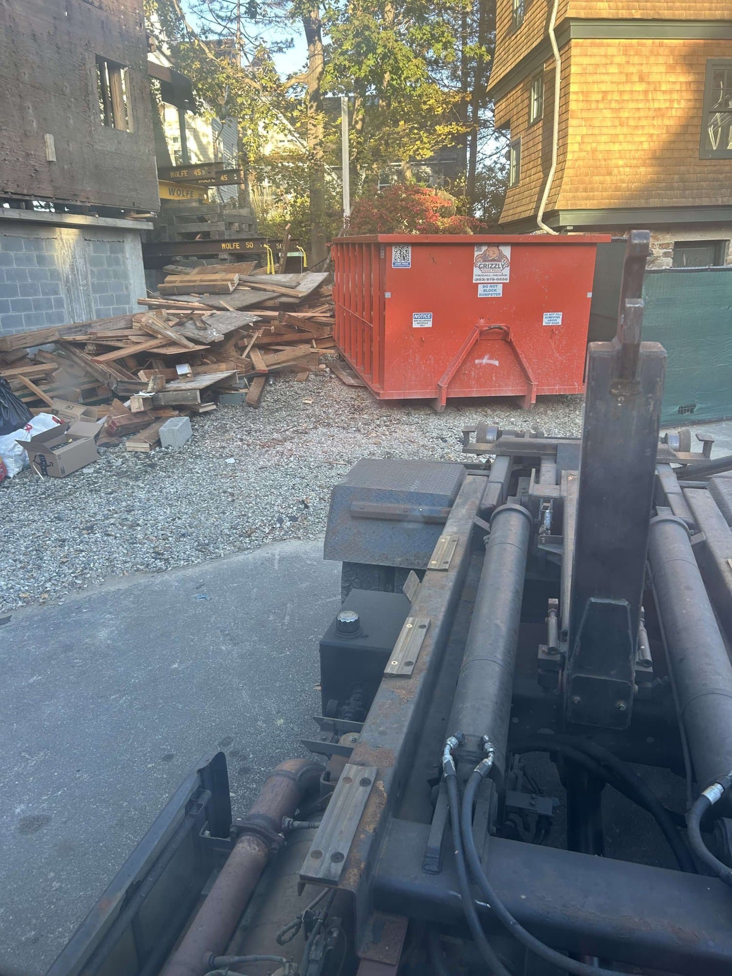 dumpster-with-debris in Norwalk, CT by Stamford Junk Pros