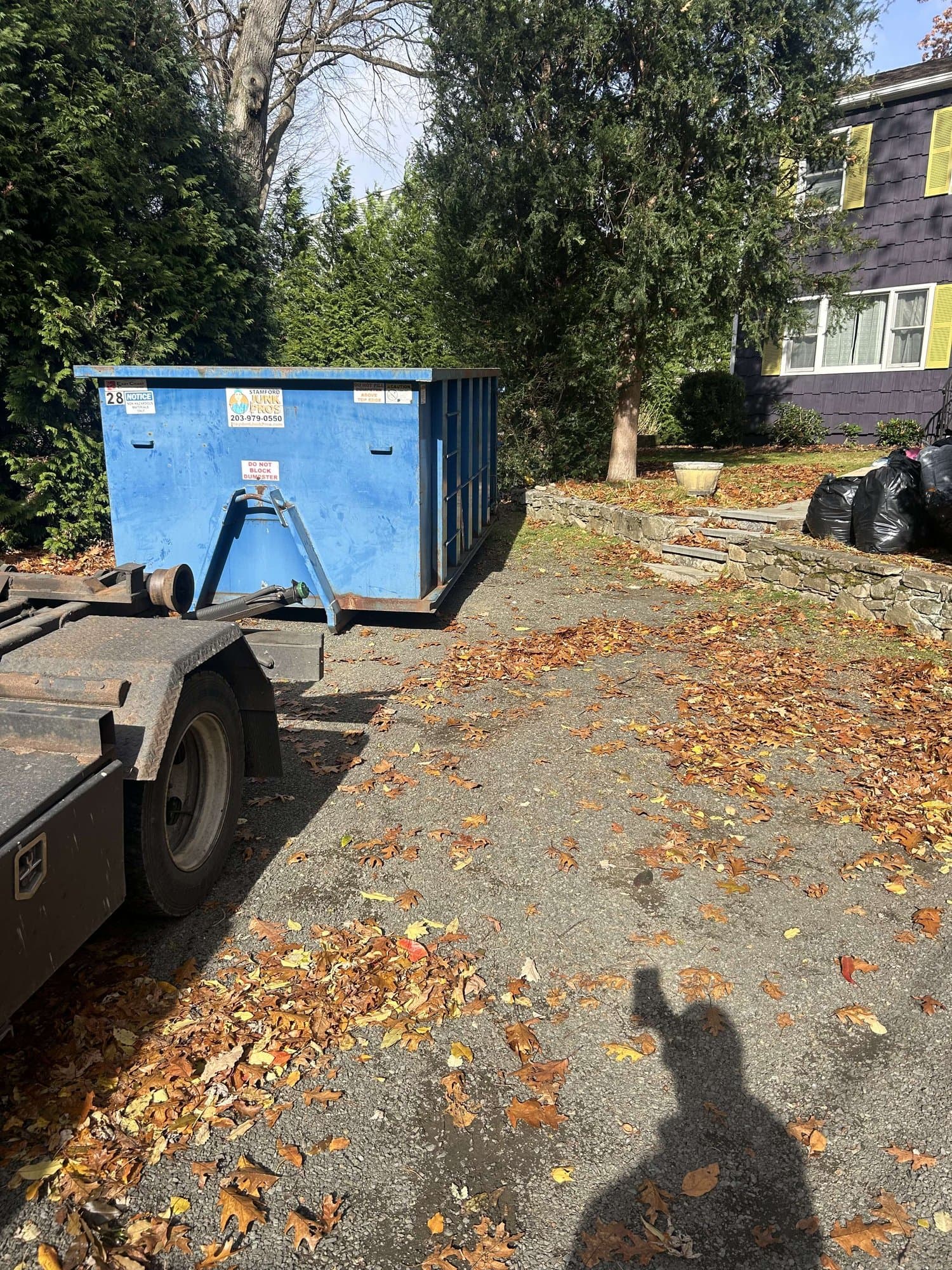 dumpster rental setup in Norwalk, CT by Grizzly Junk Pros