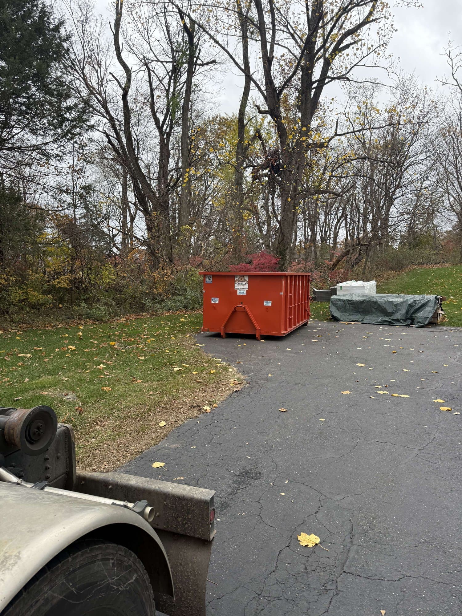 dumpster at jobsite in Shelton, CT by Grizzly Junk Pros