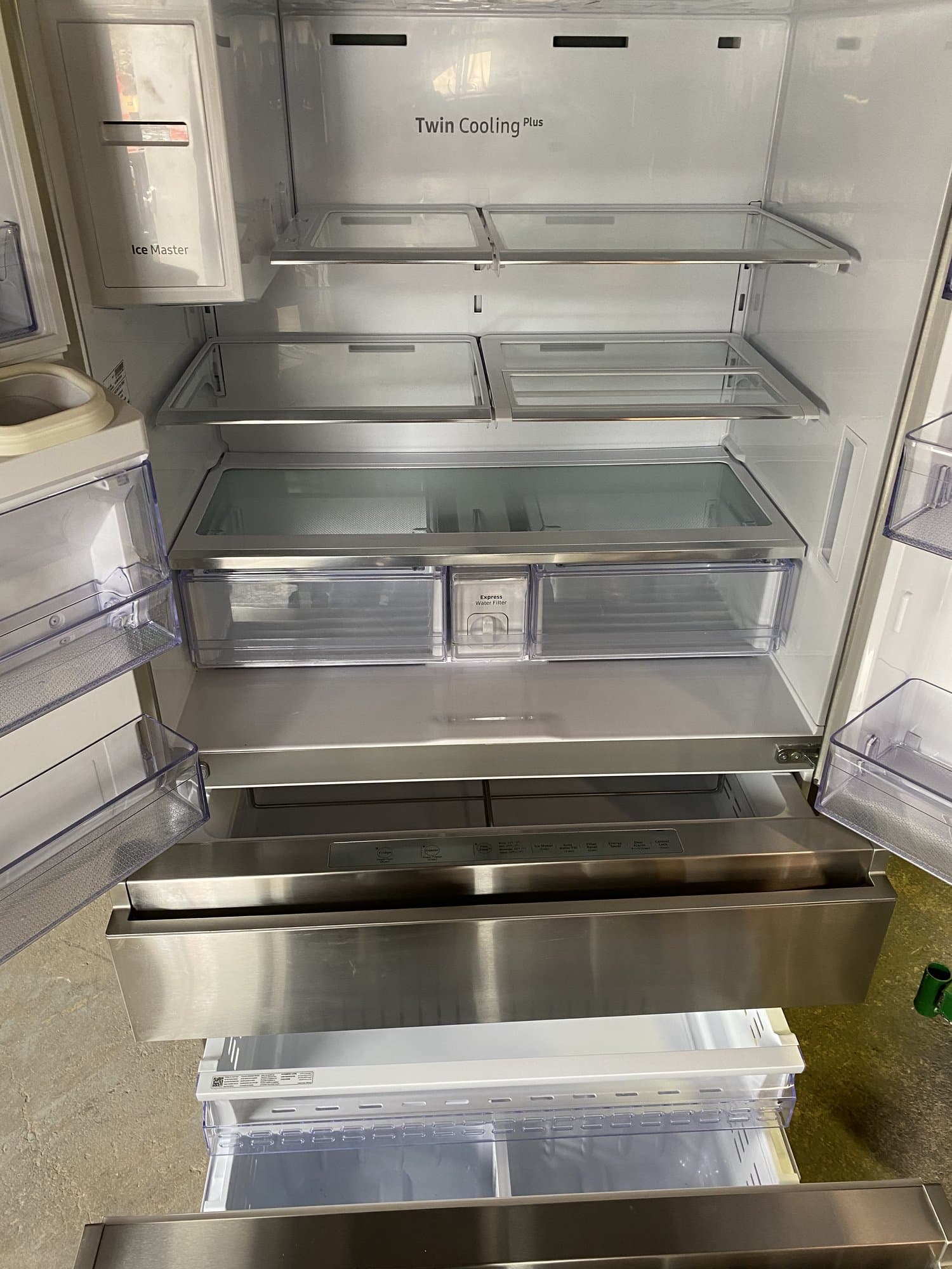 Refrigerator emptied and ready for removal from a Stamford, CT home