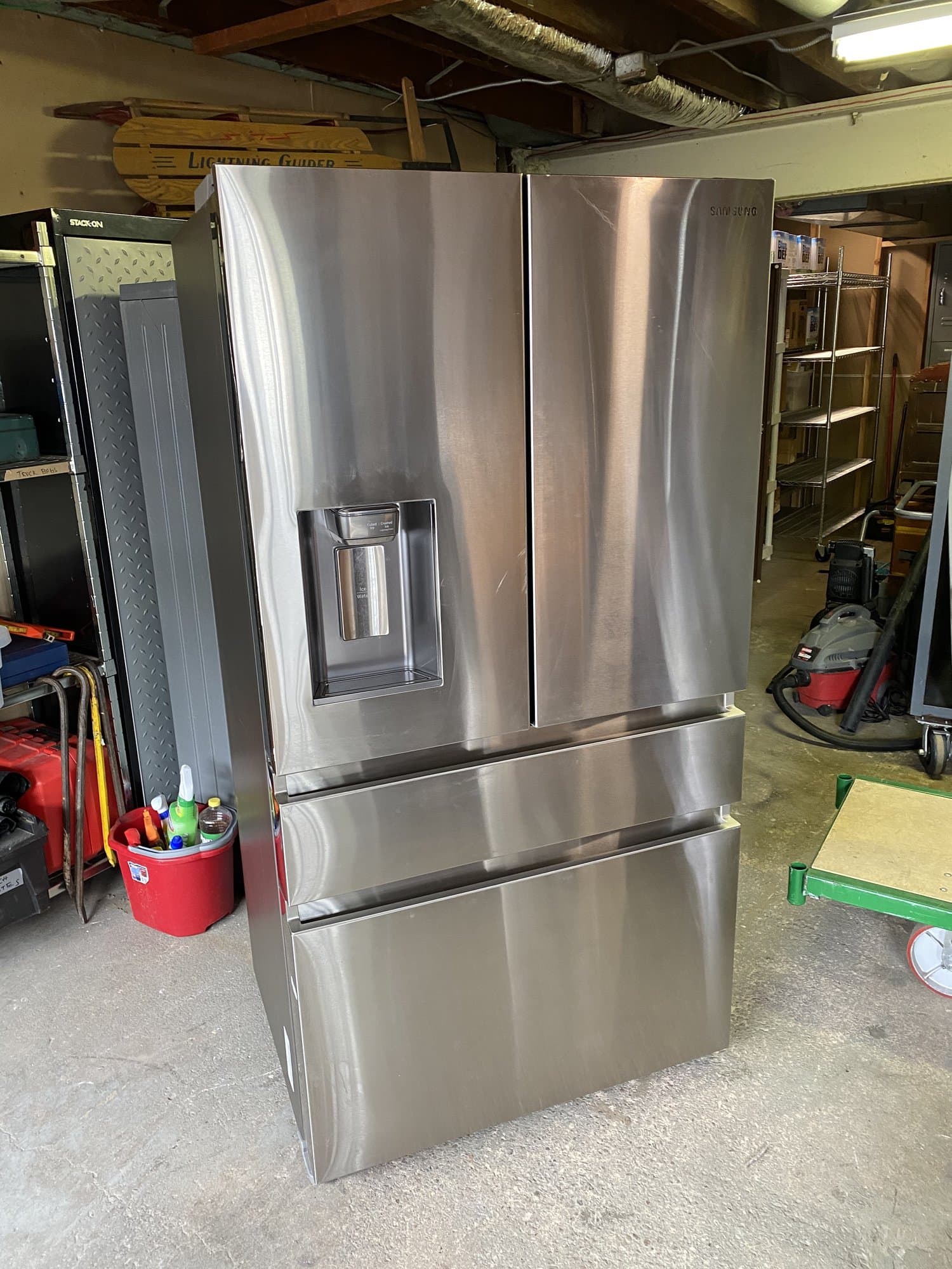 Stainless steel refrigerator staged for appliance removal by Grizzly Junk Pros in Stamford, CT