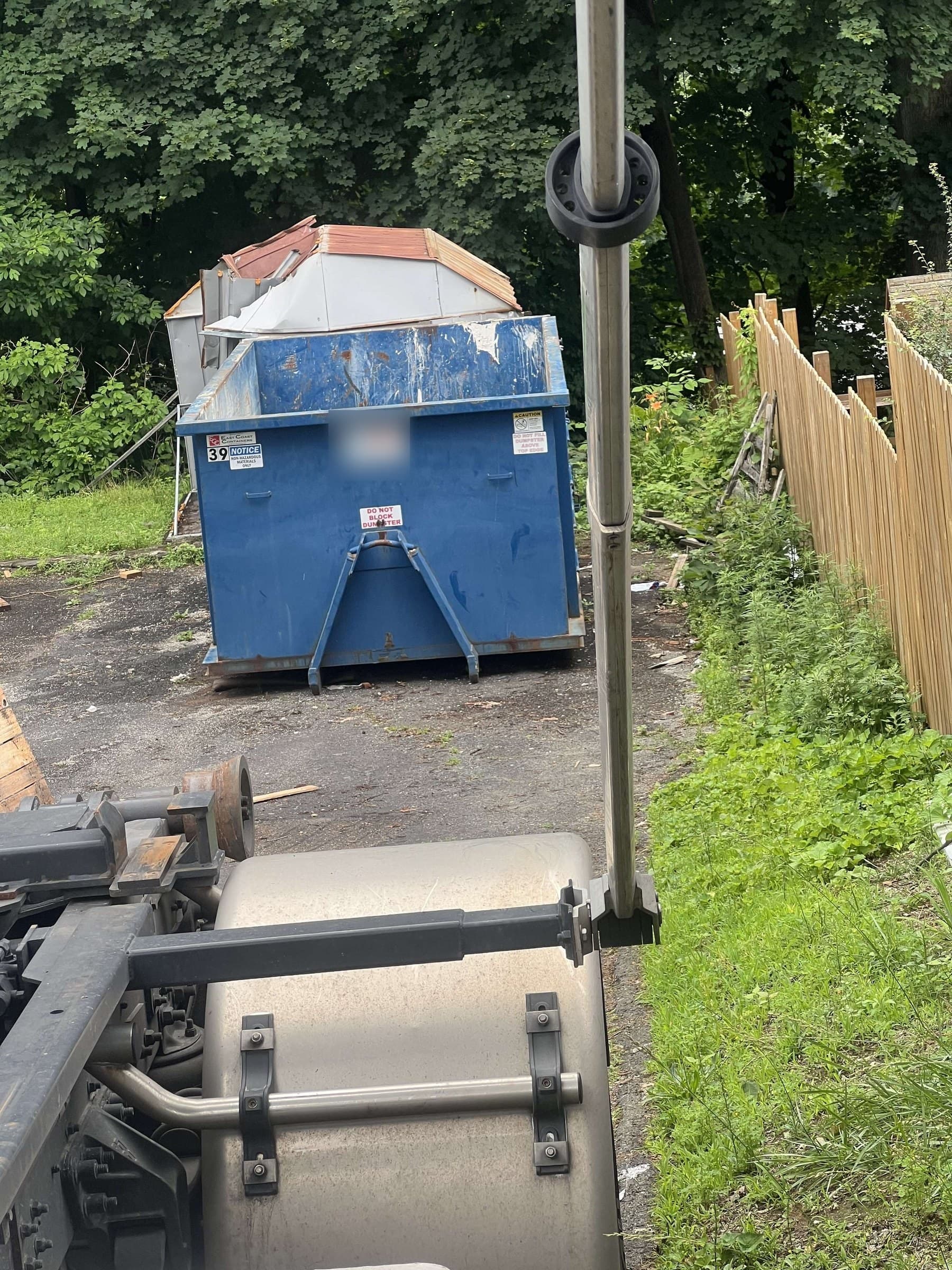 dumpster at jobsite by Grizzly Junk Pros