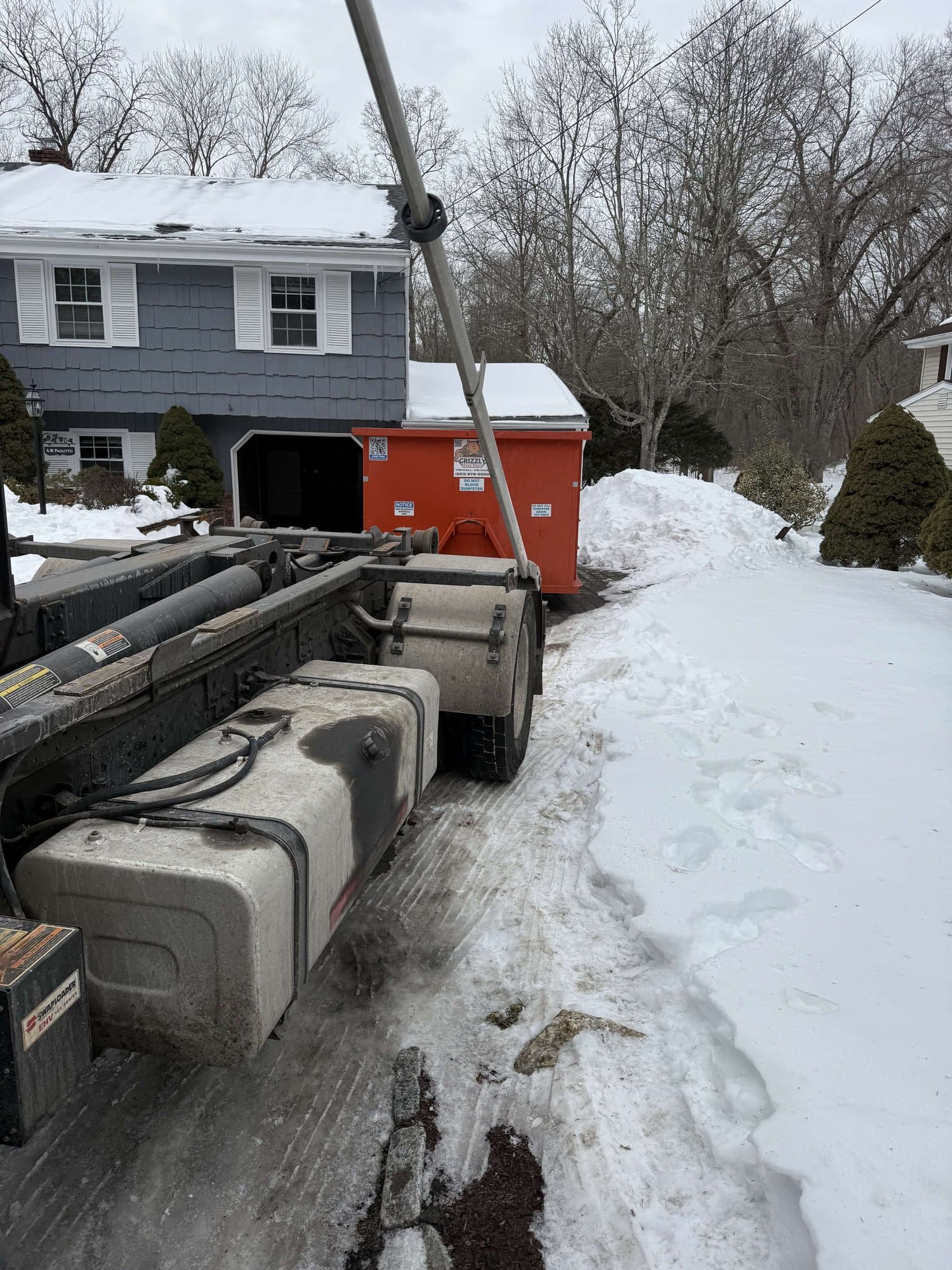 dumpster delivery winter in Stamford, CT by Grizzly Junk Pros