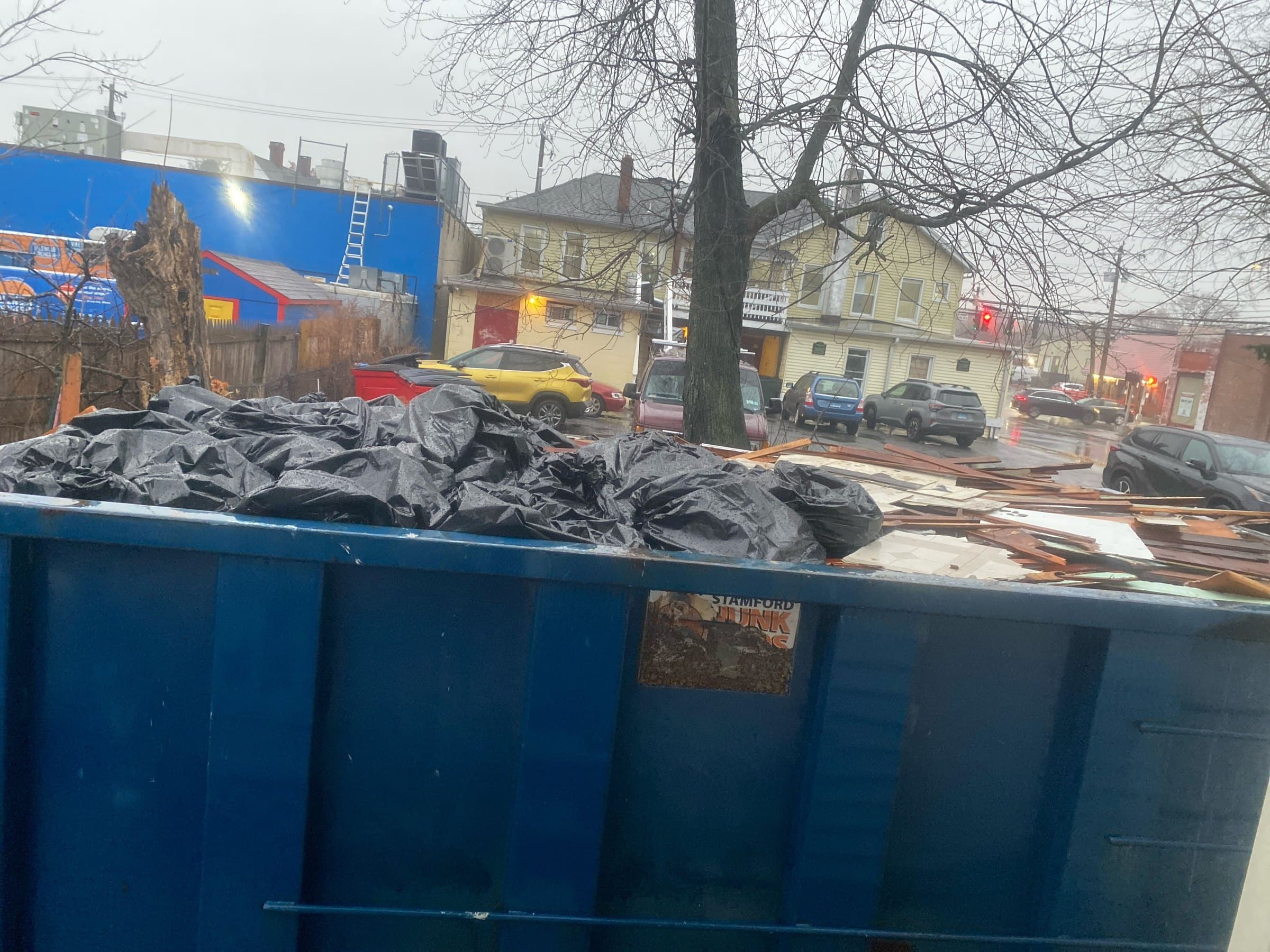 dumpster filled junk in Stamford, CT by Grizzly Junk Pros