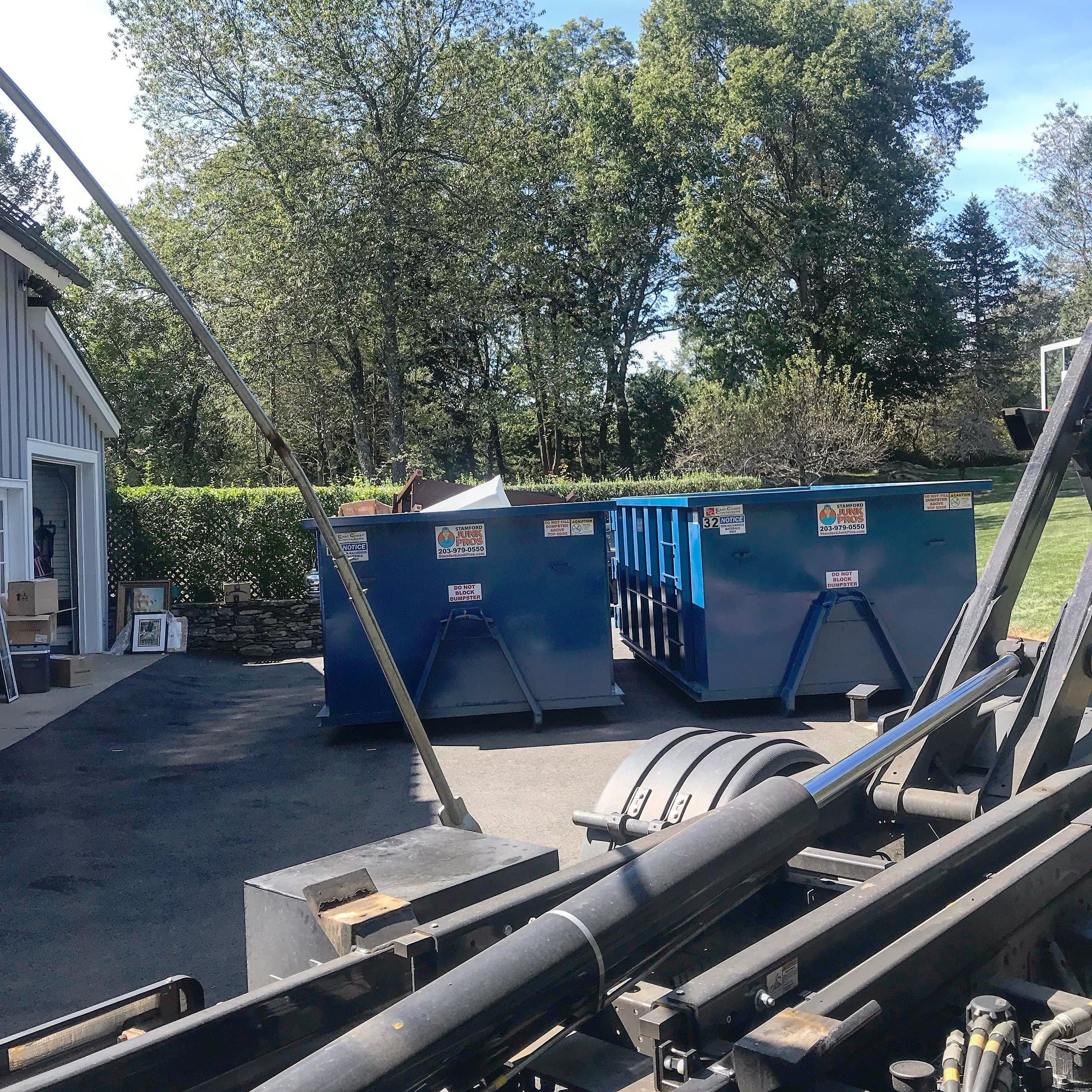 dumpster rental yard setup in Stamford, CT by Grizzly Junk Pros