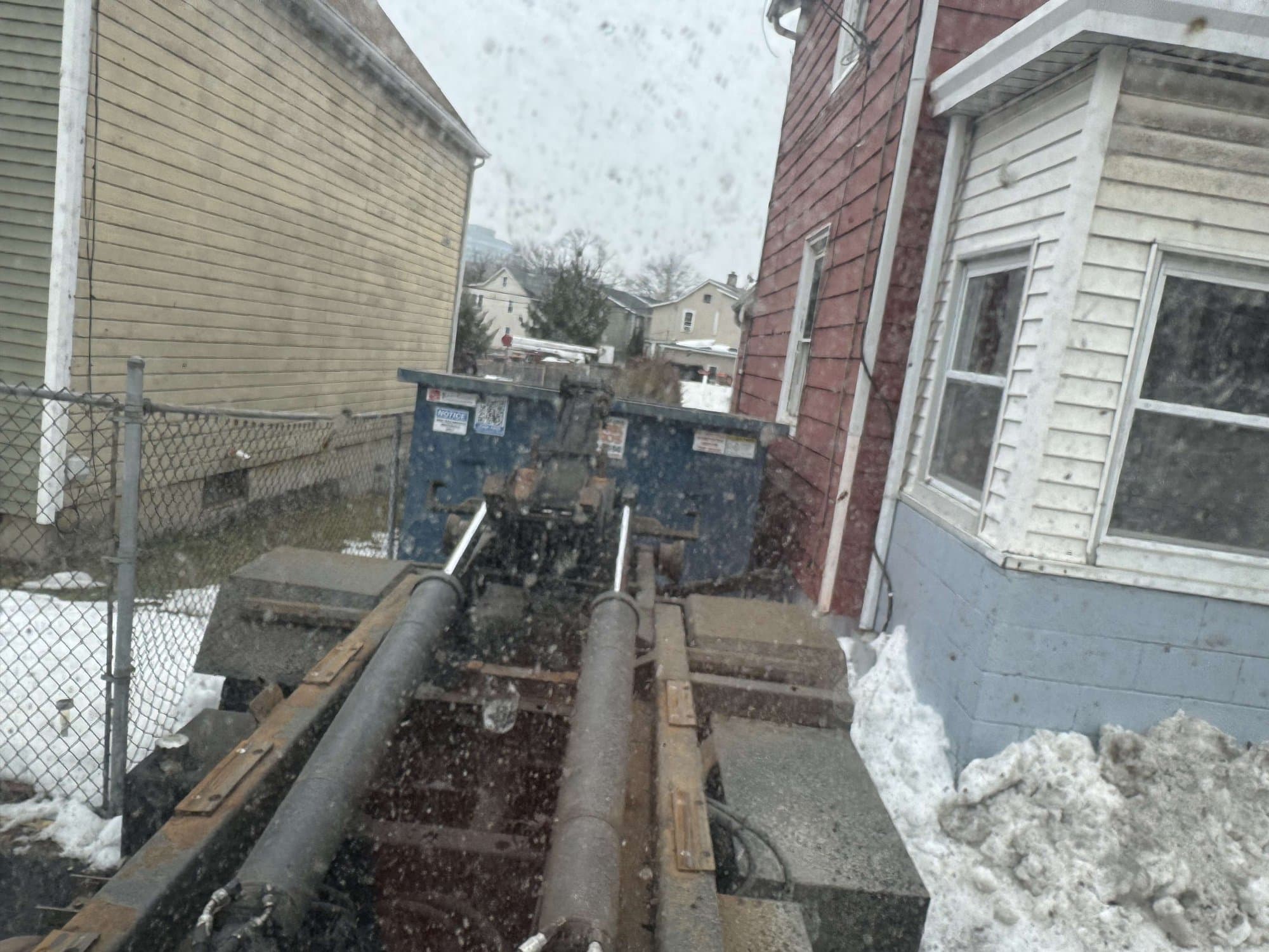 dumpster truck loading by Grizzly Junk Pros