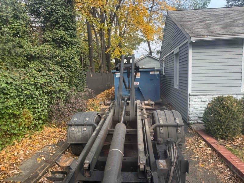 dumpster-truck-loading in Stamford, CT by Grizzly Junk Pros