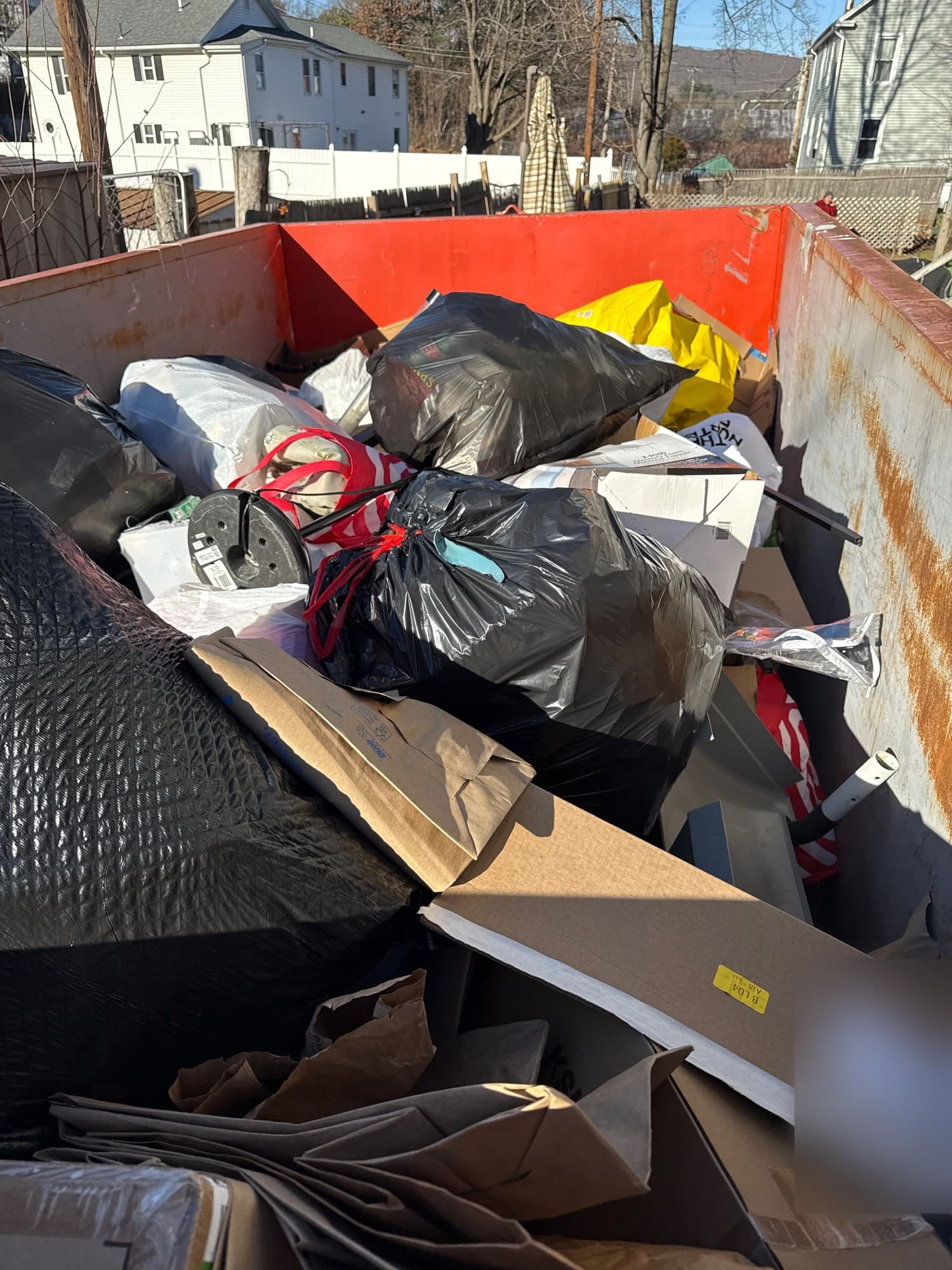 dumpster full junk by Grizzly Junk Pros