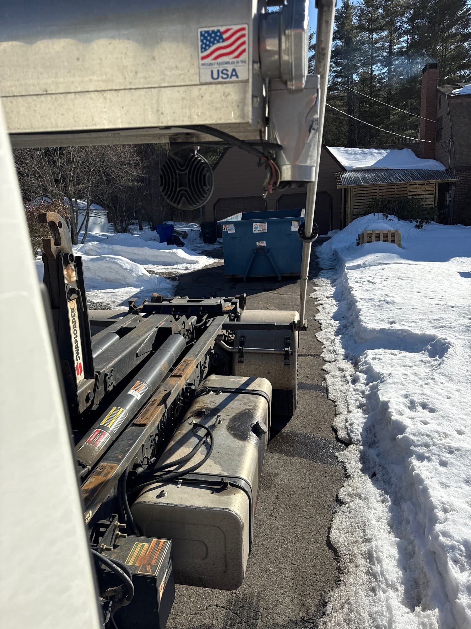 dumpster truck winter in Torrington, CT by Grizzly Junk Pros