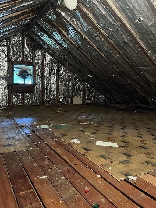 Attic cleanout in progress — Grizzly Junk Pros removing accumulated items and debris