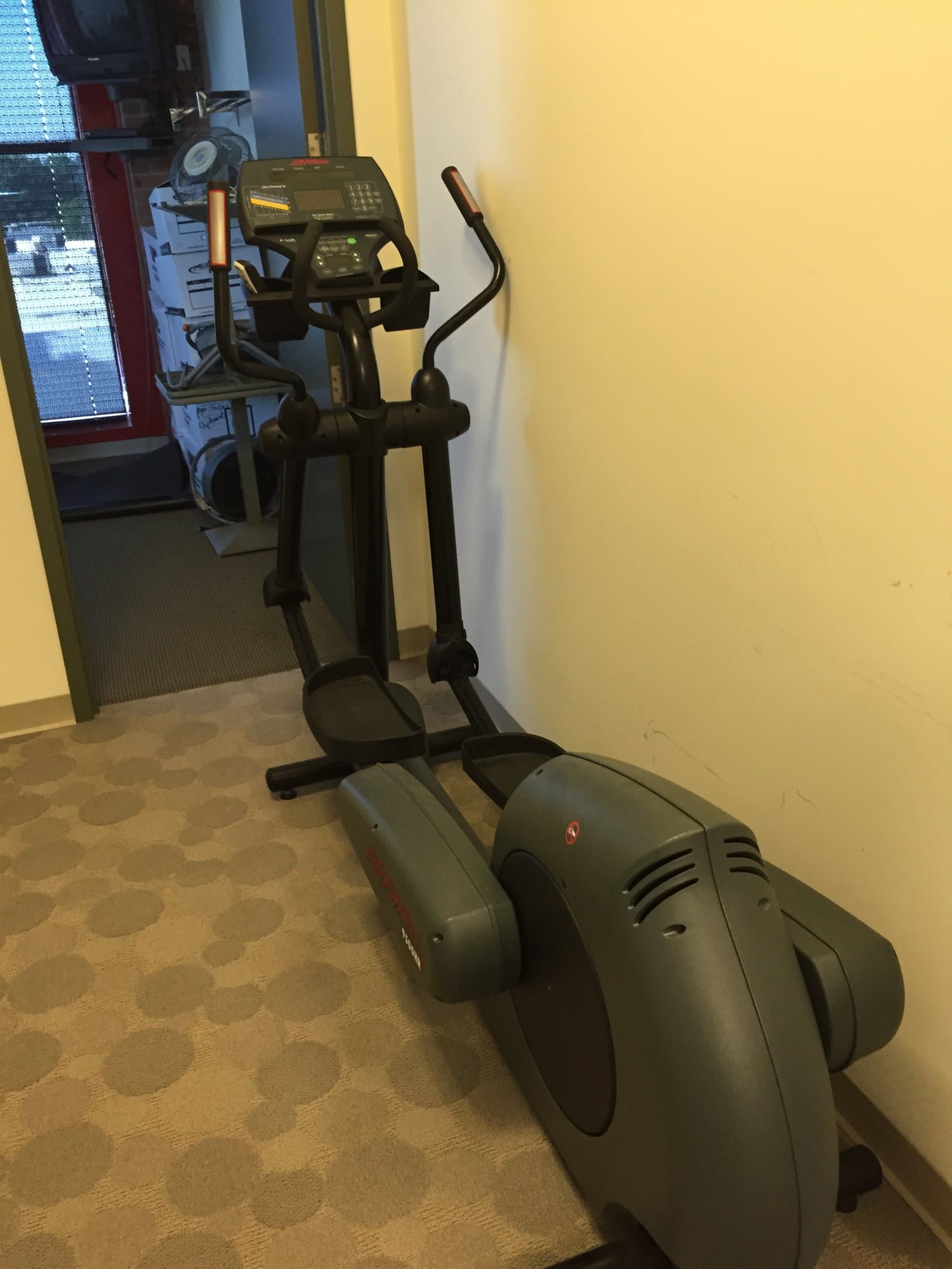 Home exercise equipment staged for removal by Grizzly Junk Pros