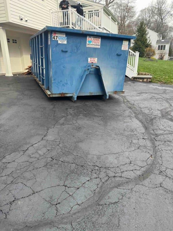Roll-off dumpster delivery in Hartford County by Grizzly Junk Pros