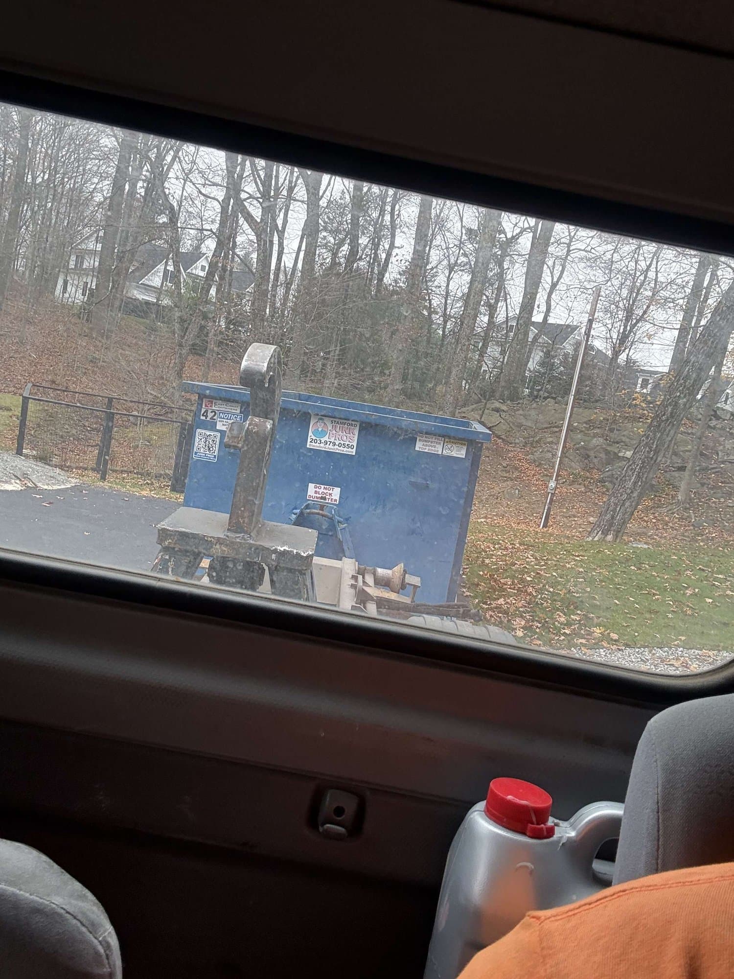 blue dumpster residential by Grizzly Junk Pros