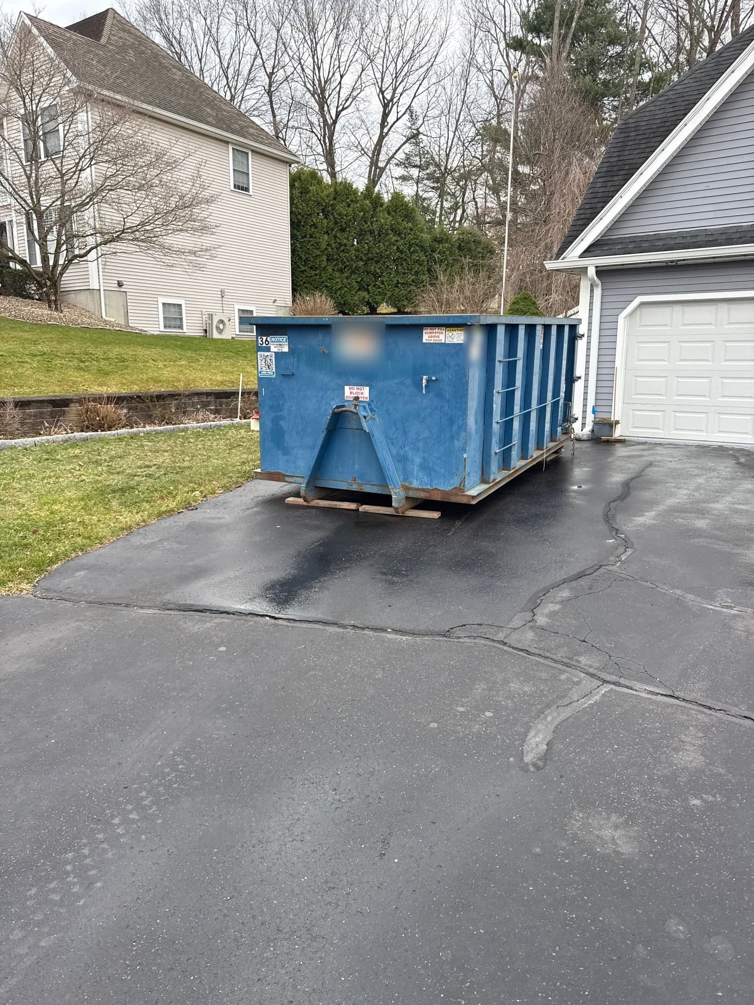 Roll-off dumpster delivery by Grizzly Junk Pros