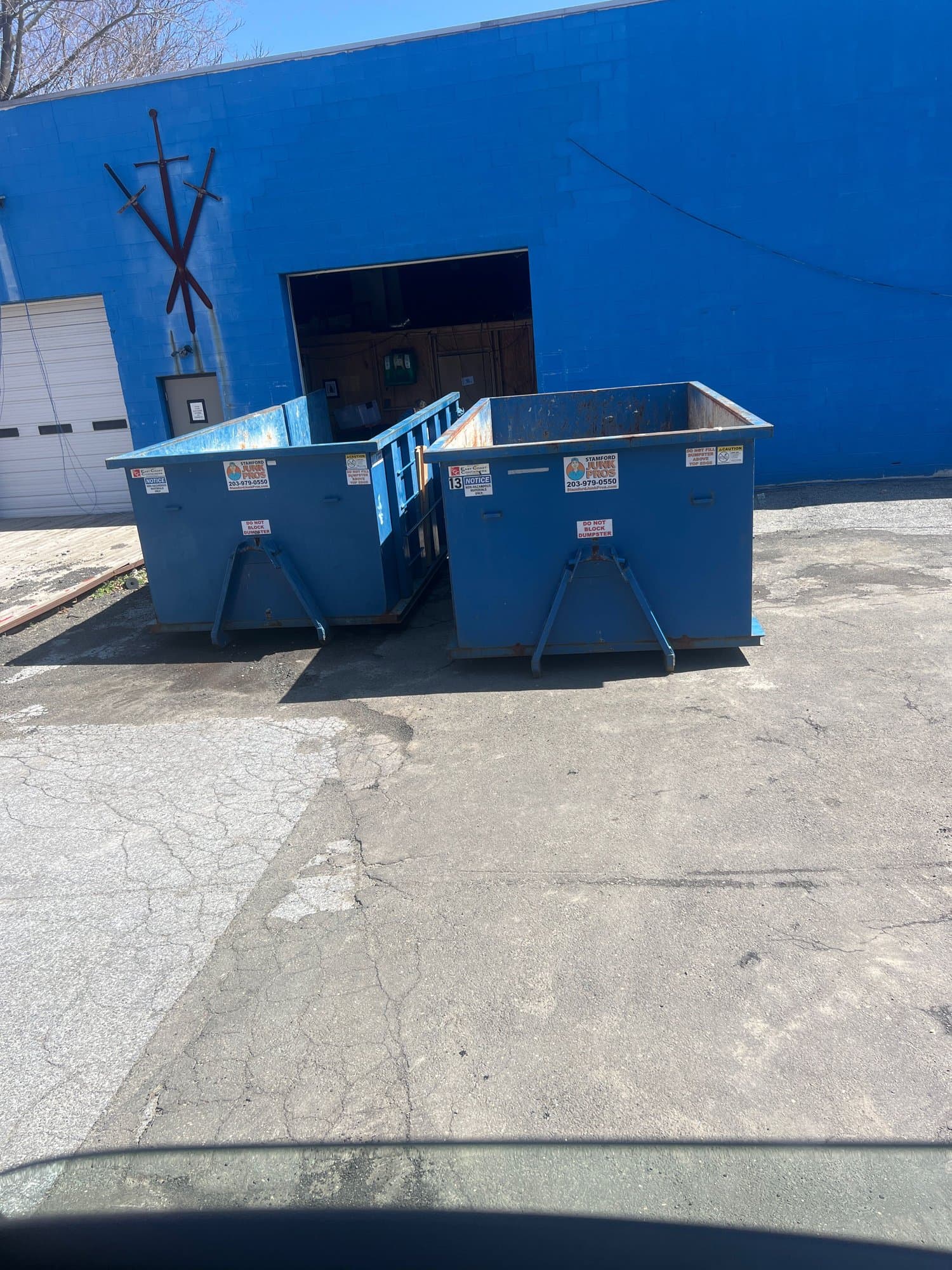 Roll-off dumpster delivery by Grizzly Junk Pros