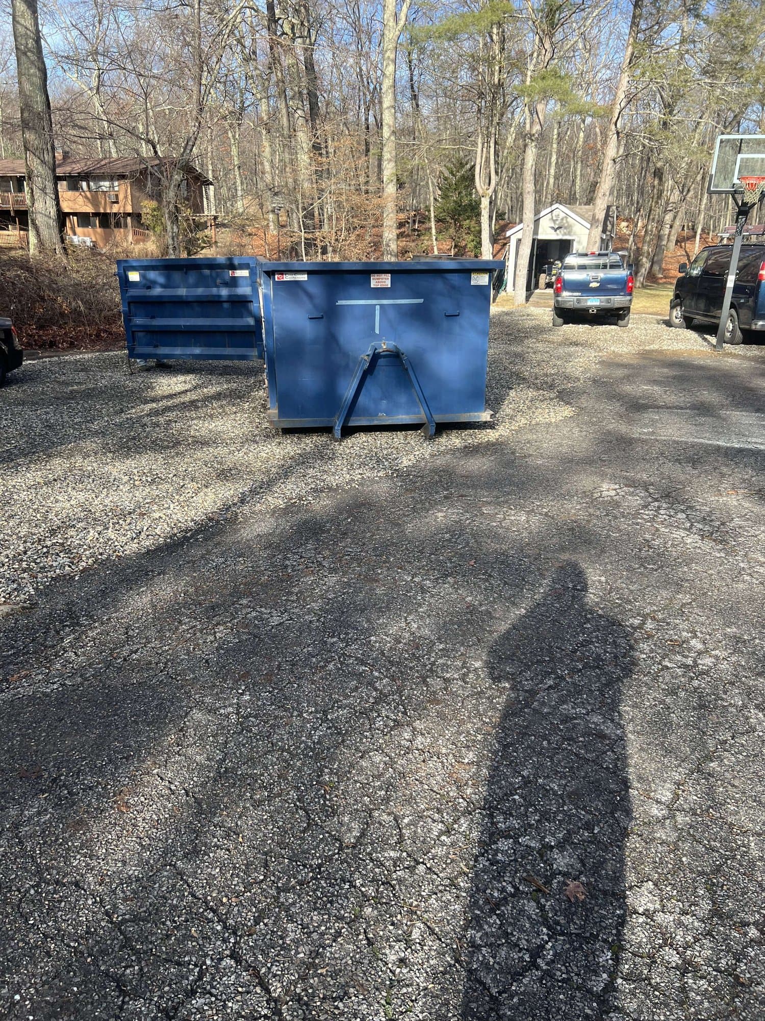 blue dumpsters residential by Grizzly Junk Pros