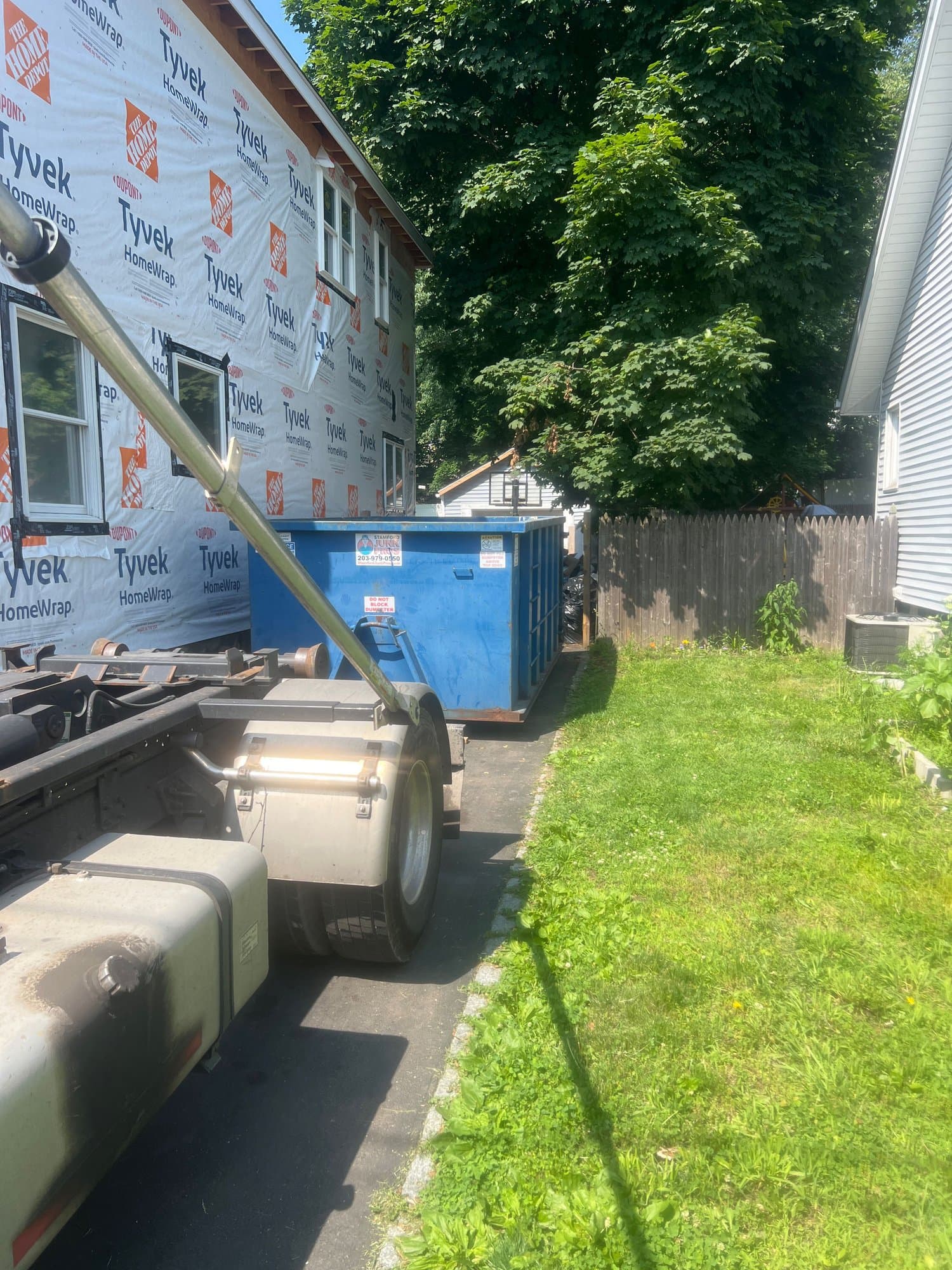 dumpster and debris by Grizzly Junk Pros