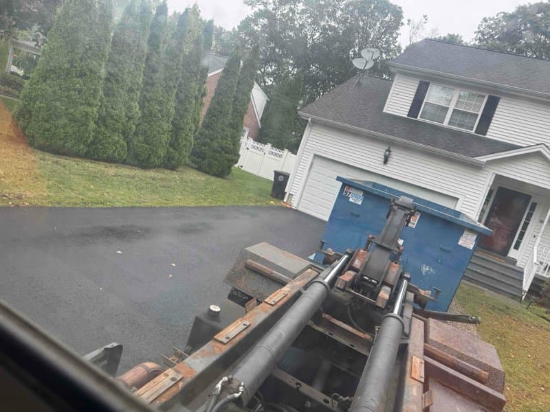 dumpster and debris by Grizzly Junk Pros