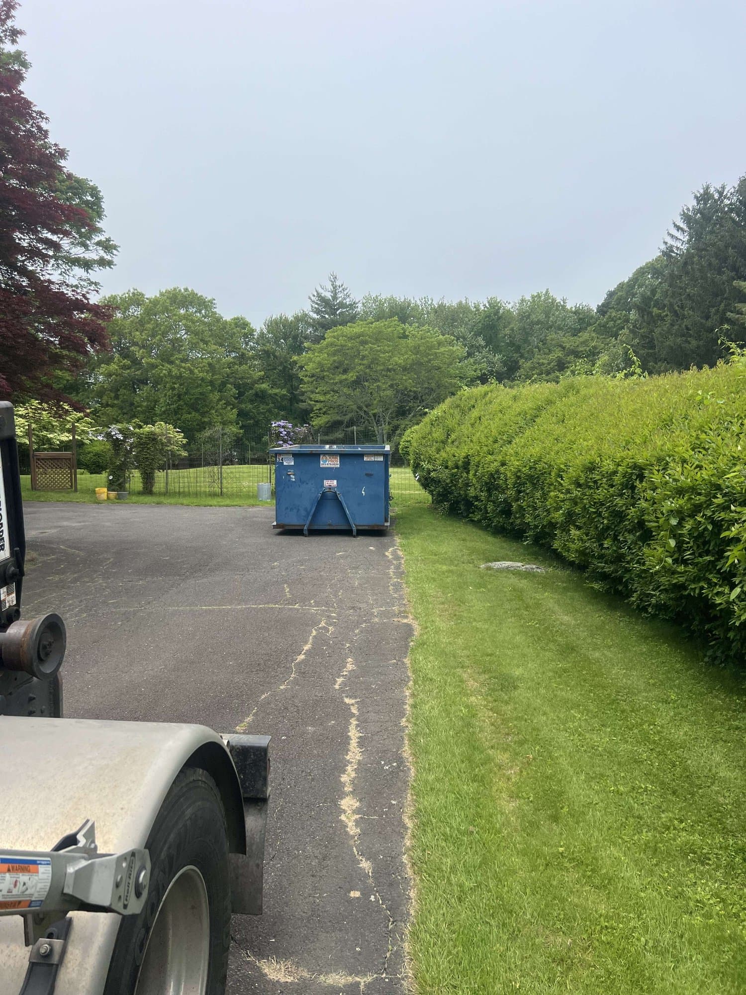 dumpster at jobsite by Grizzly Junk Pros