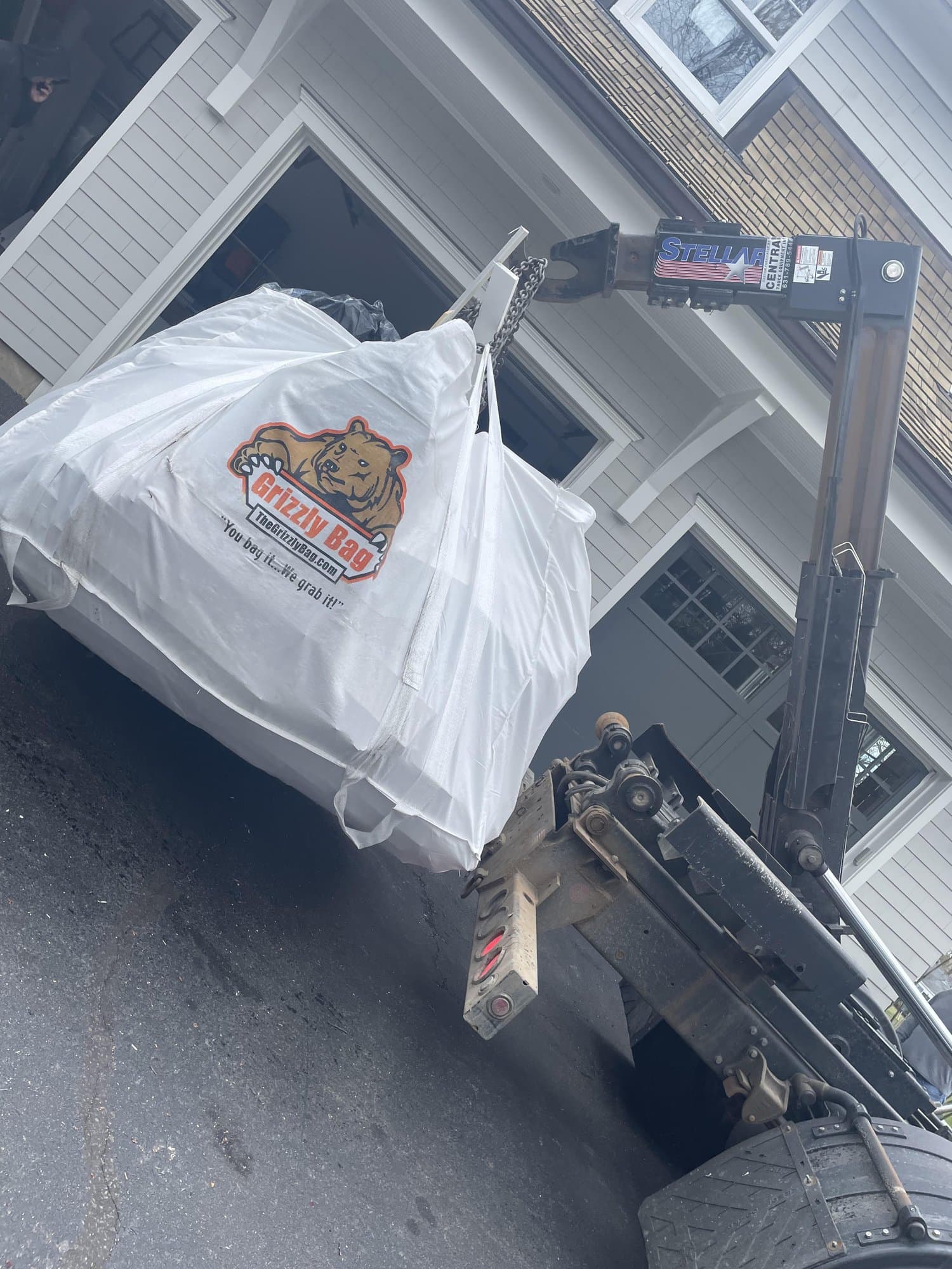 dumpster bag loading by Grizzly Junk Pros