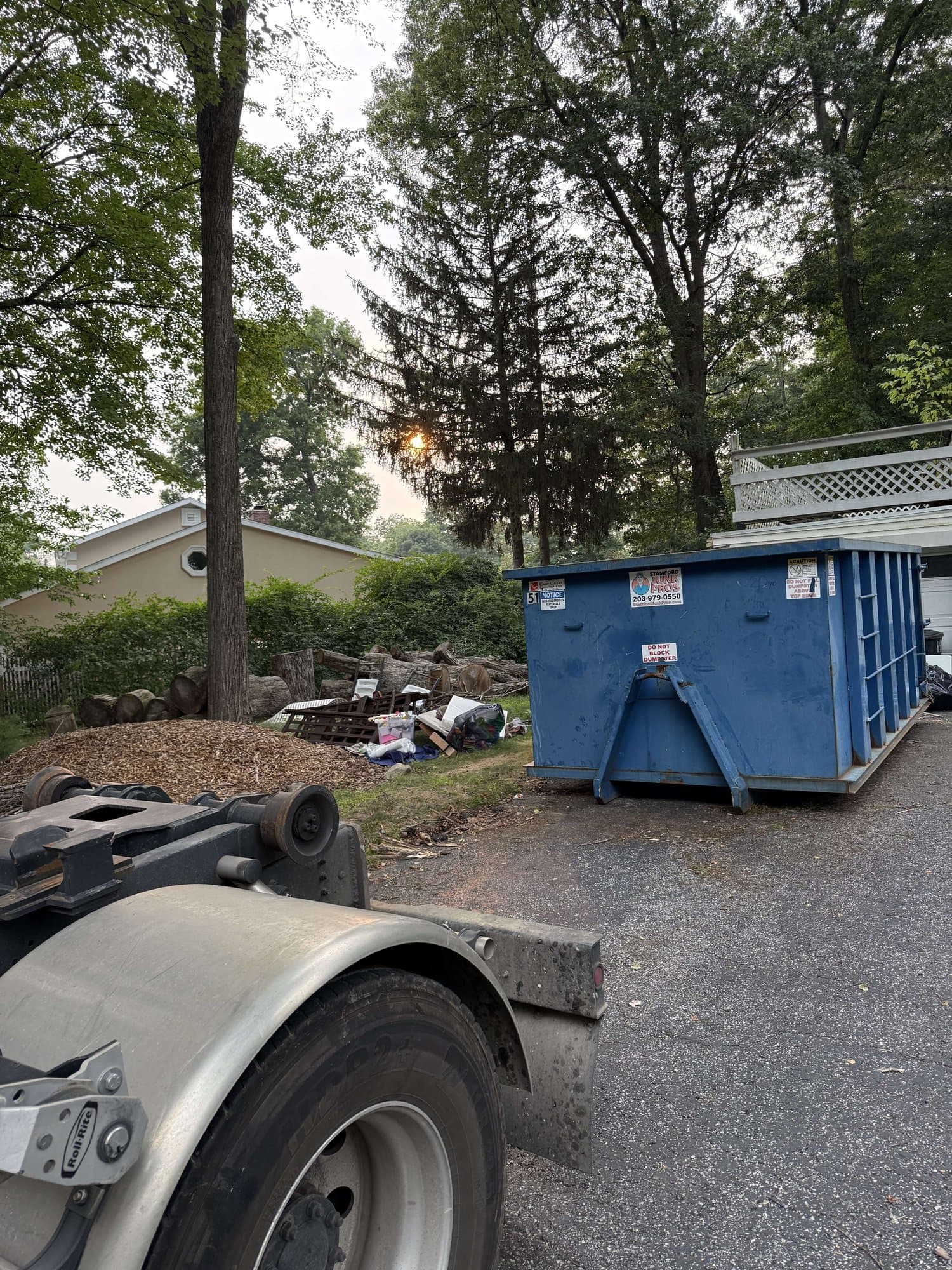 dumpster debris removal in Danbury, CT by Grizzly Junk Pros