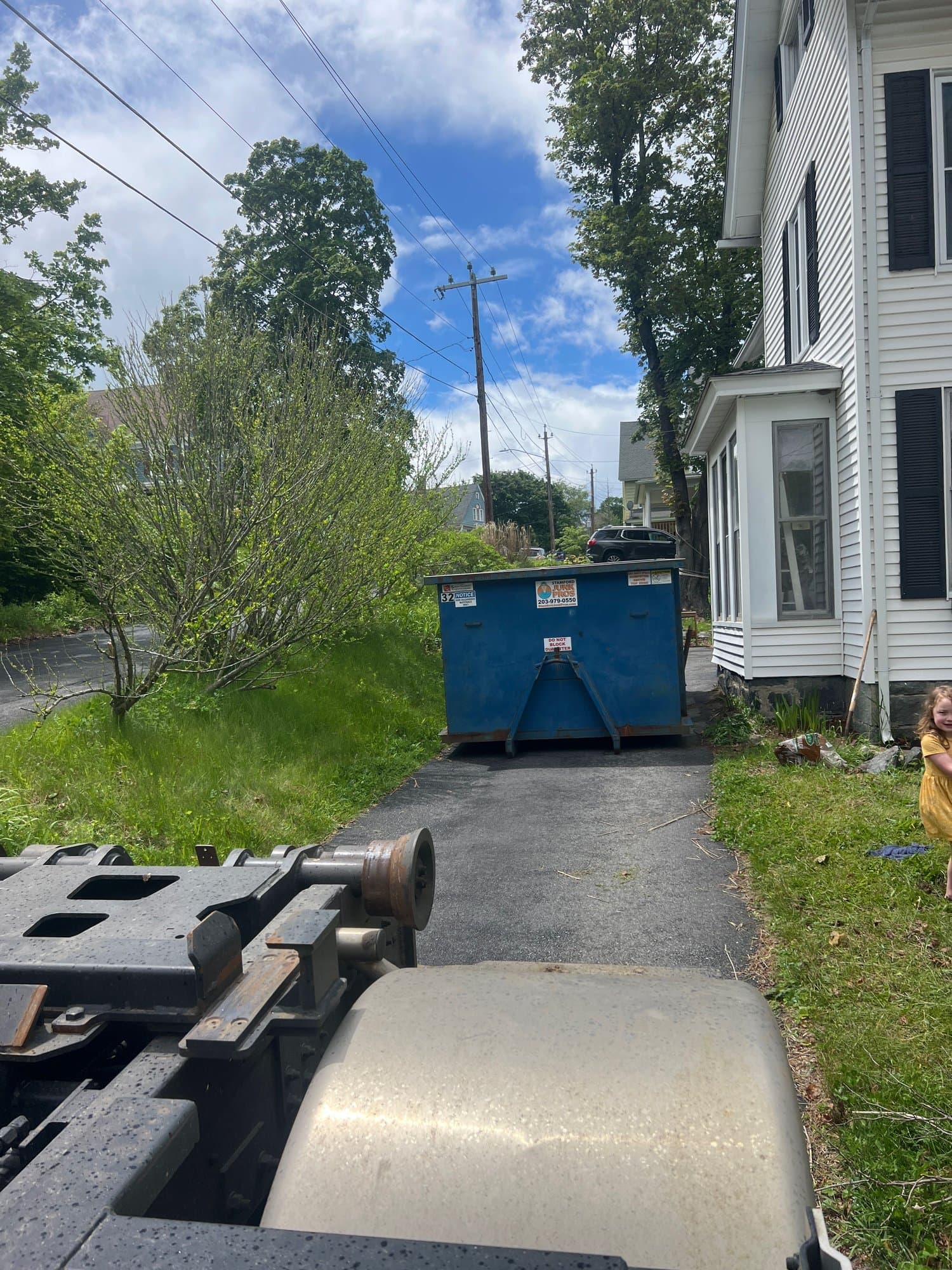 dumpster delivery driveway by Grizzly Junk Pros