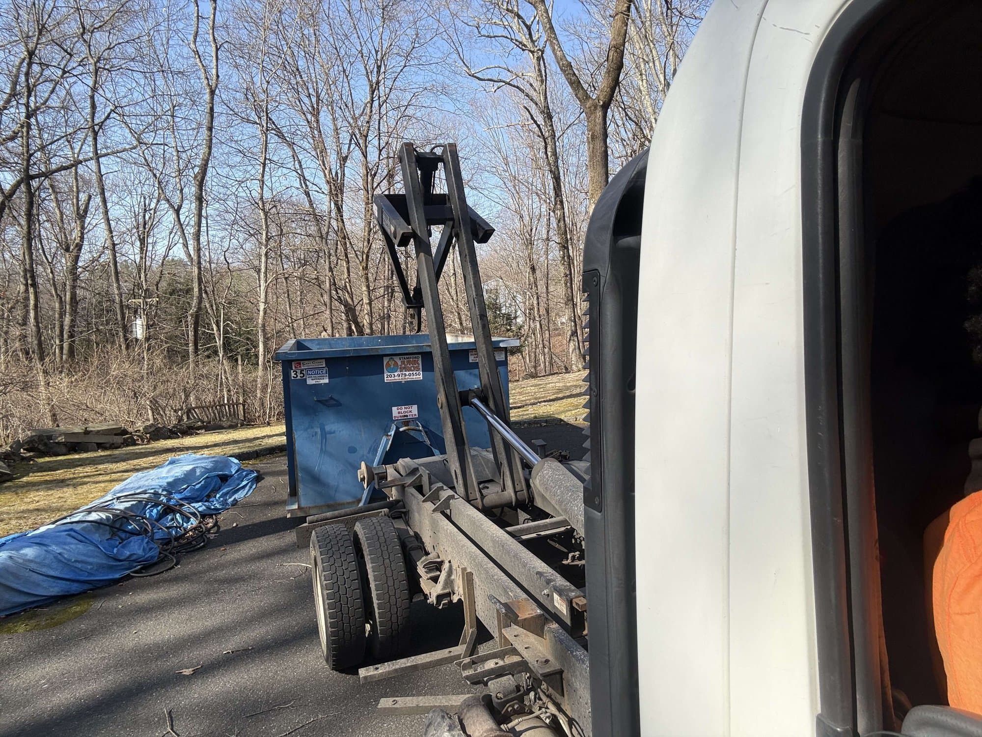 Roll-off dumpster delivery by Grizzly Junk Pros
