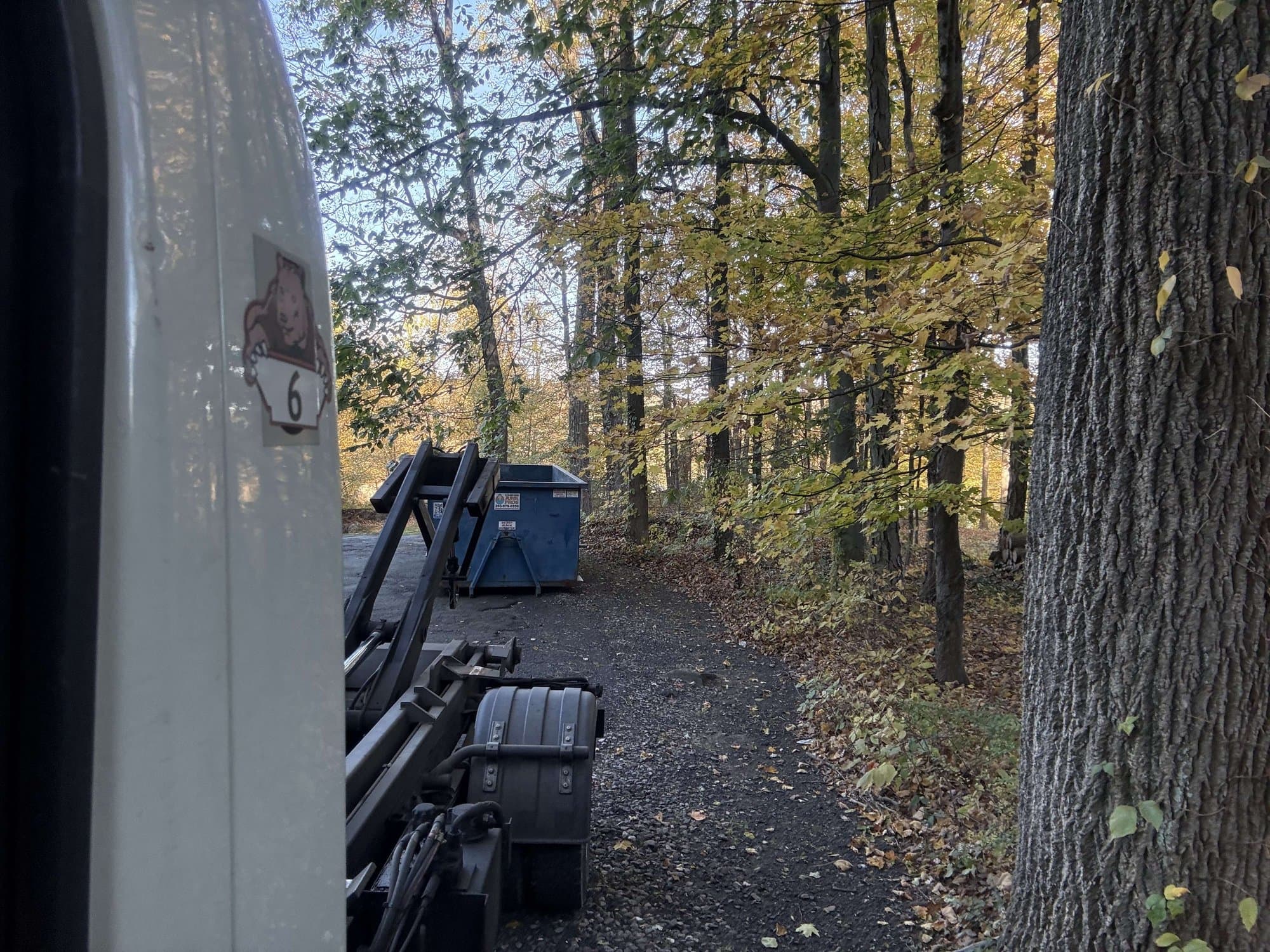 Roll-off dumpster delivery by Grizzly Junk Pros