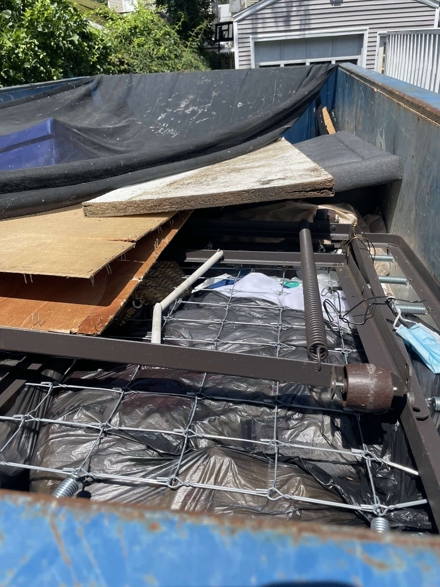 dumpster full junk by Grizzly Junk Pros