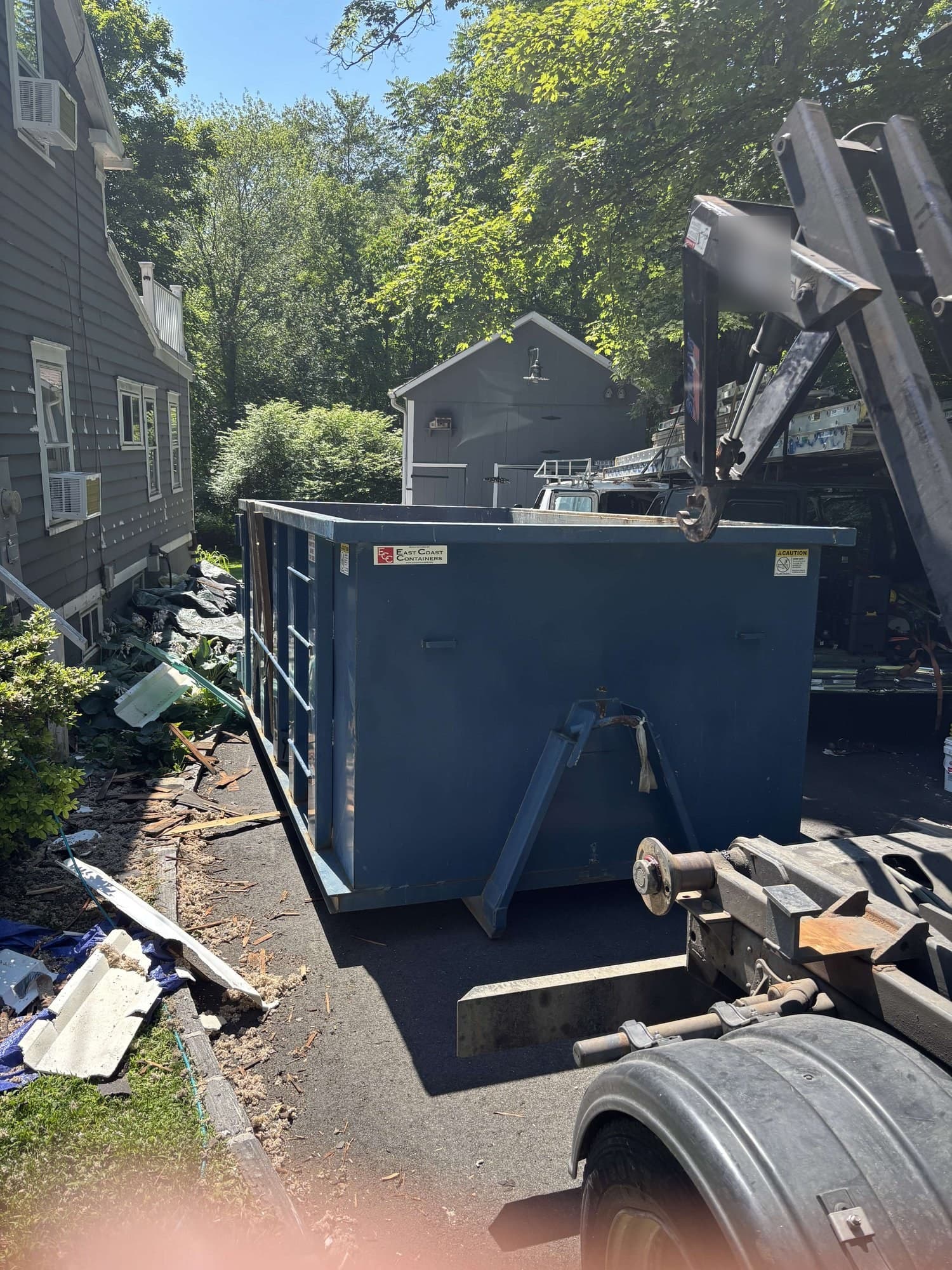dumpster loading jobsite by Grizzly Junk Pros