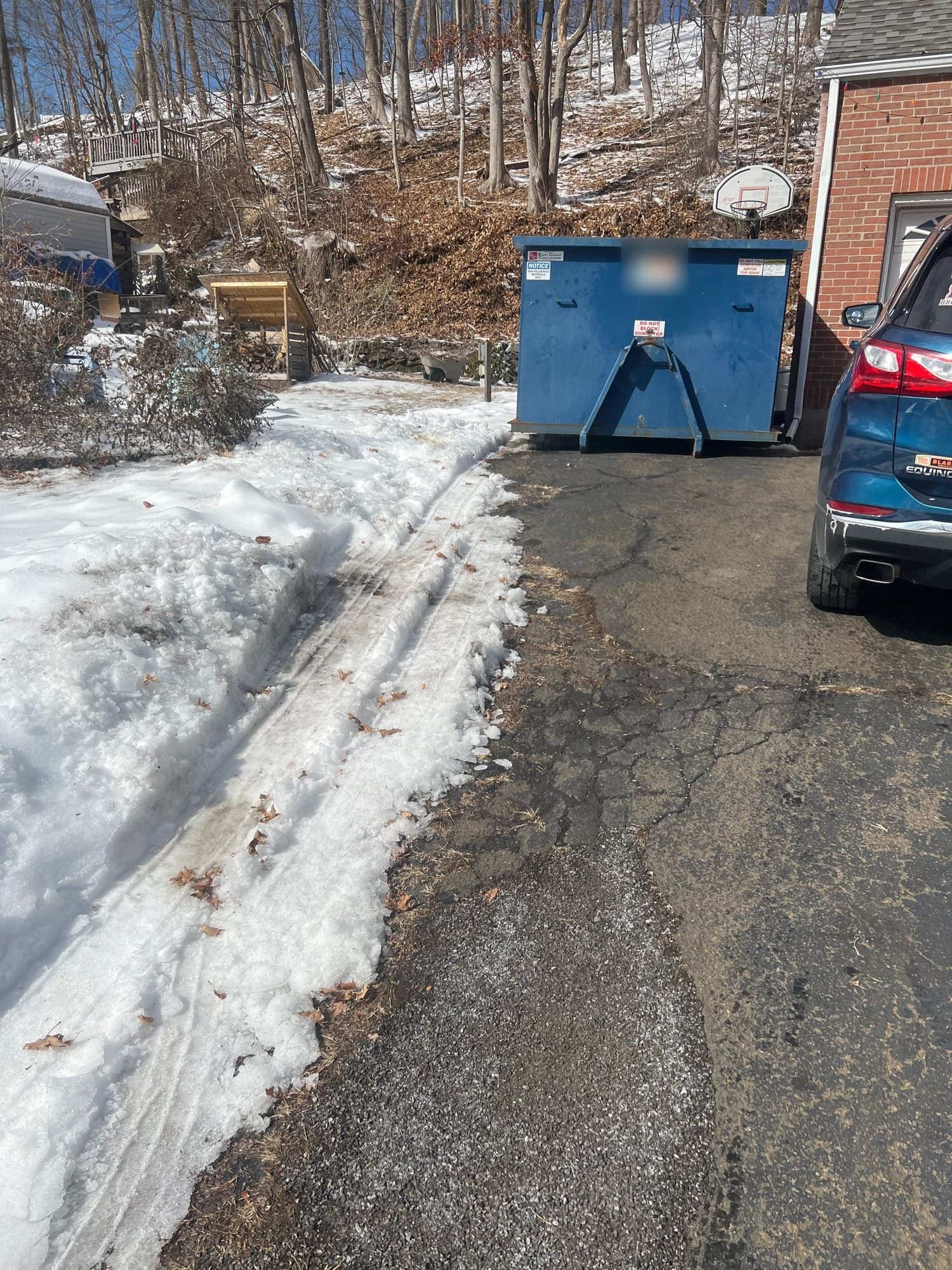 dumpster placement driveway by Grizzly Junk Pros