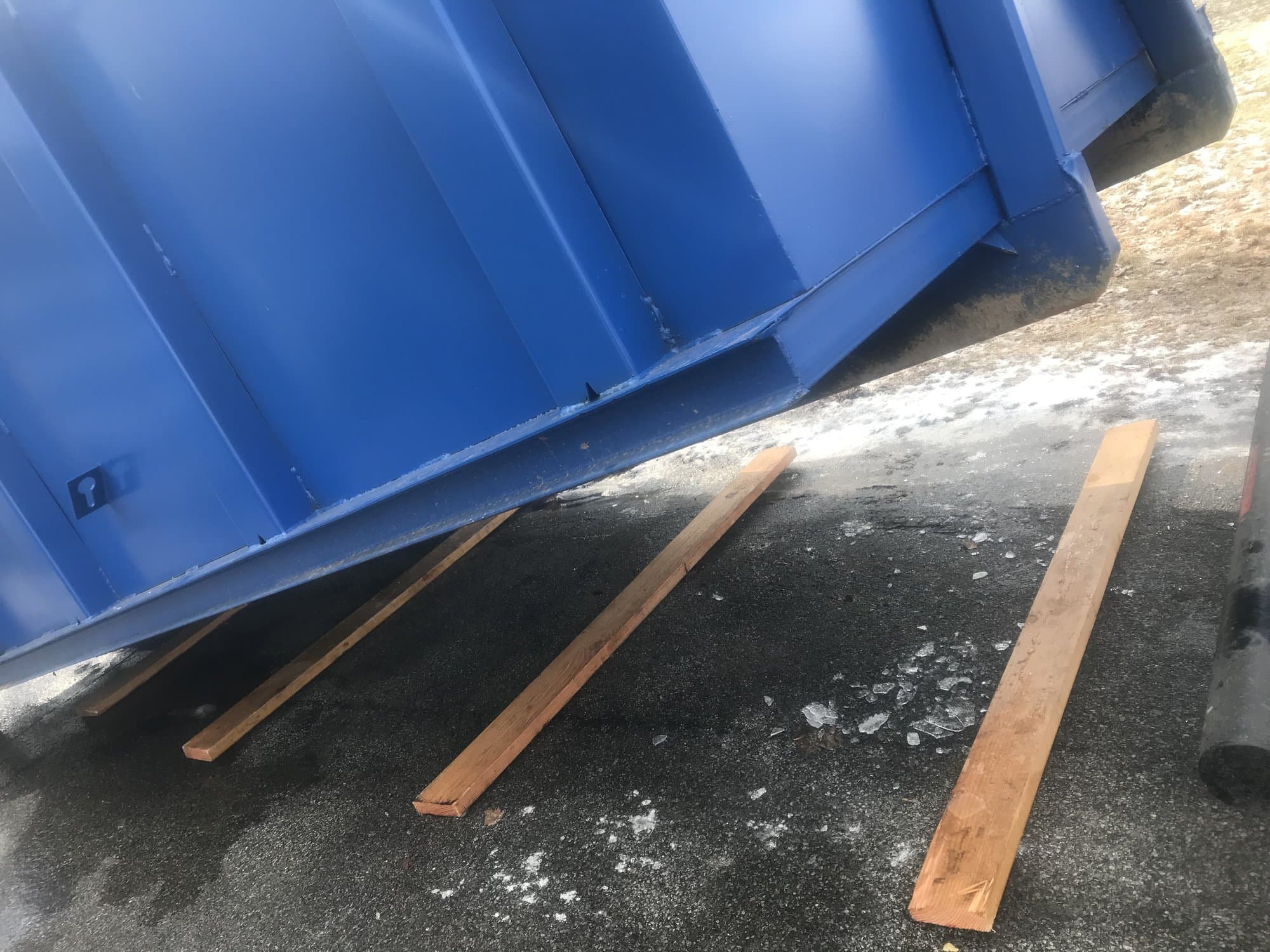 Roll-off dumpster delivery by Grizzly Junk Pros