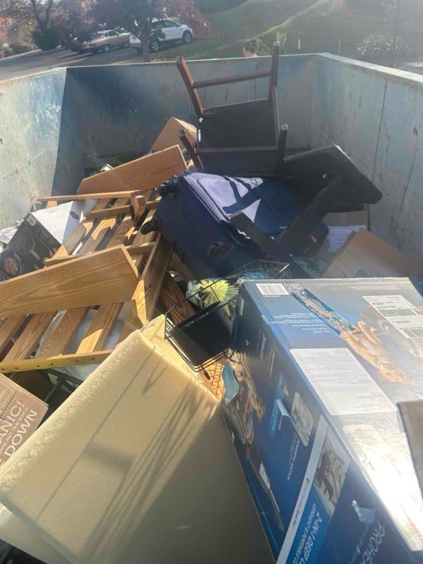 full dumpster junk load by Grizzly Junk Pros