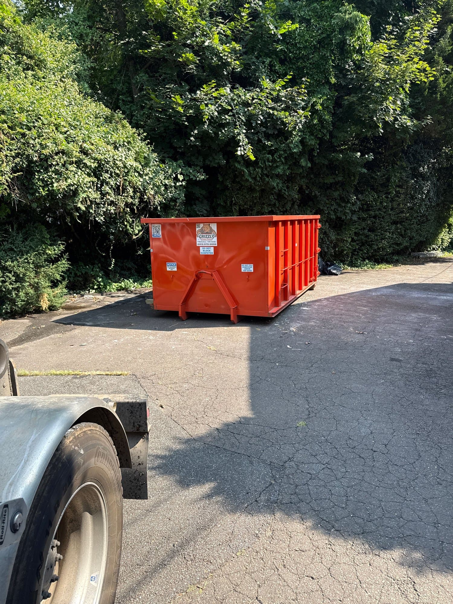red dumpster placement by Grizzly Junk Pros