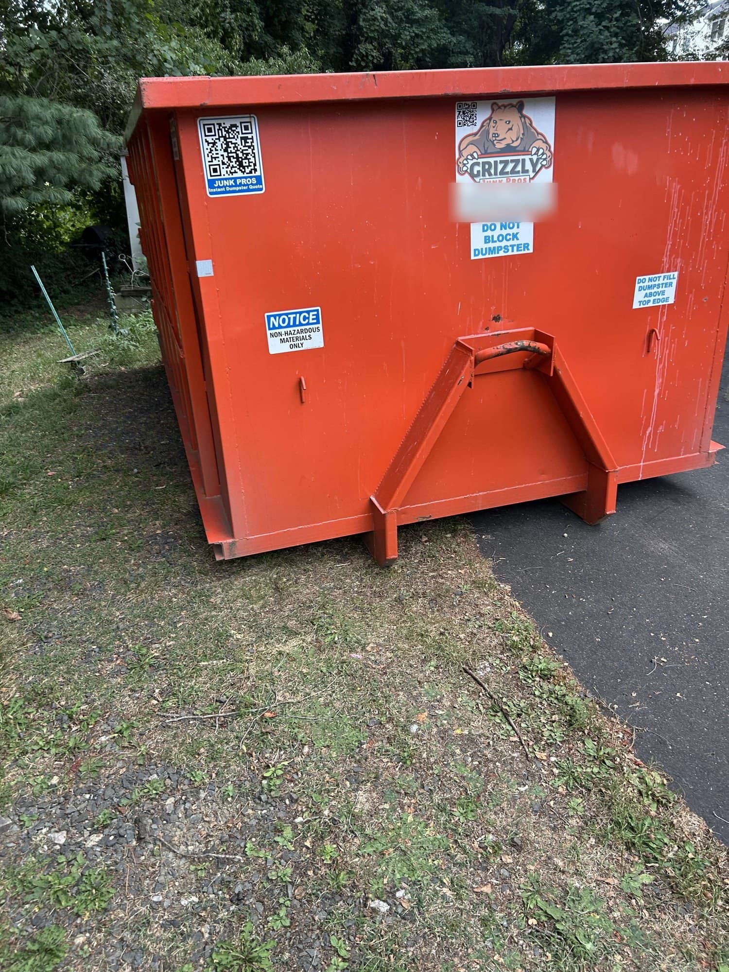 red dumpster placement by Grizzly Junk Pros