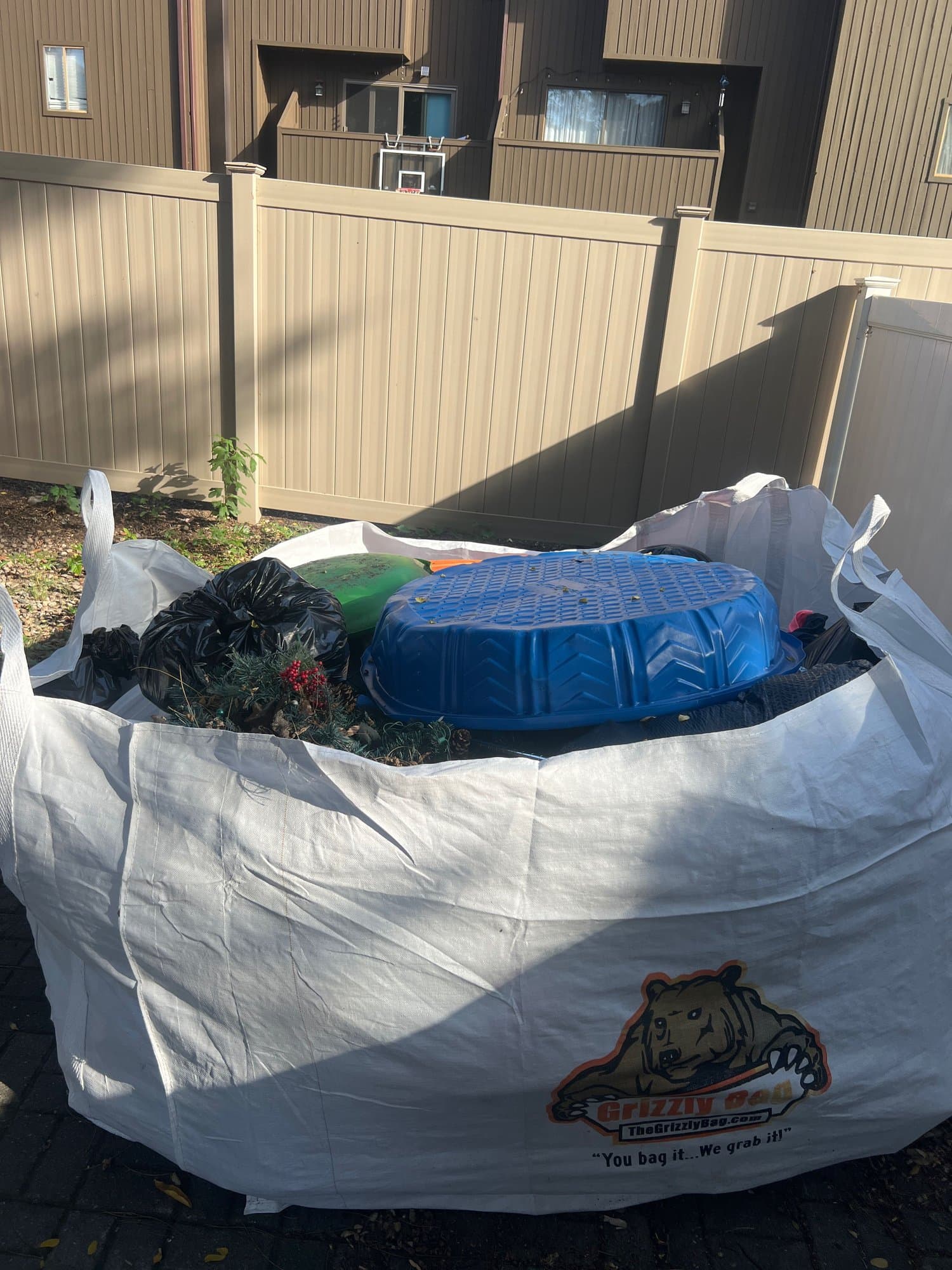 dumpster bag full by Grizzly Junk Pros