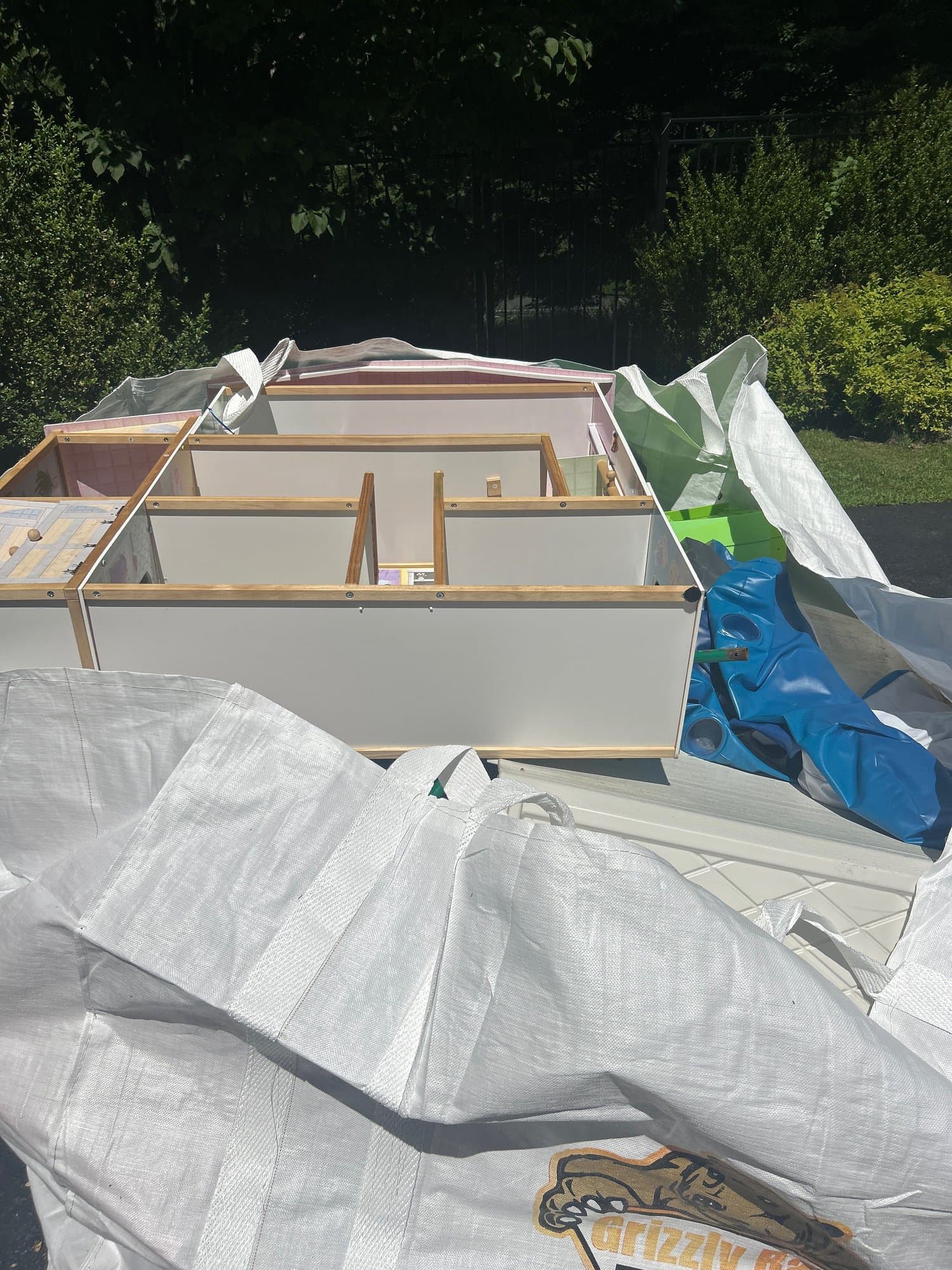 dumpster full debris by Grizzly Junk Pros