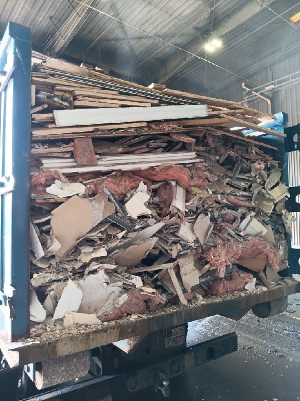 loaded debris truck by Grizzly Junk Pros