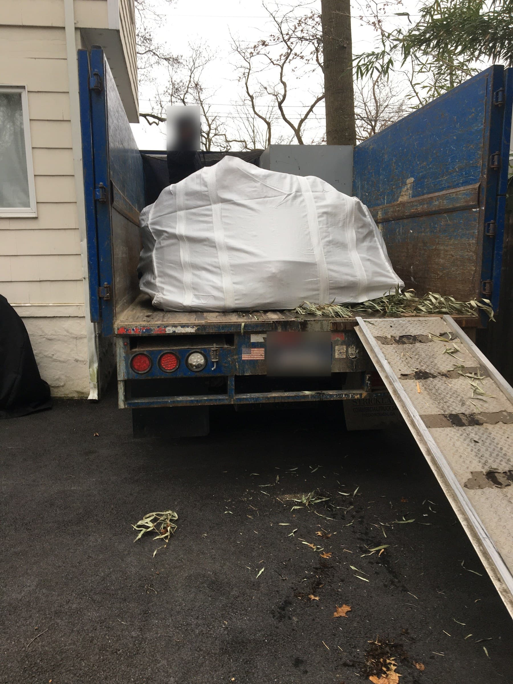 truck loading debris removal by Grizzly Junk Pros