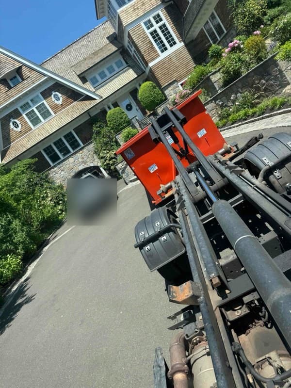 dumpster truck loaded by Grizzly Junk Pros