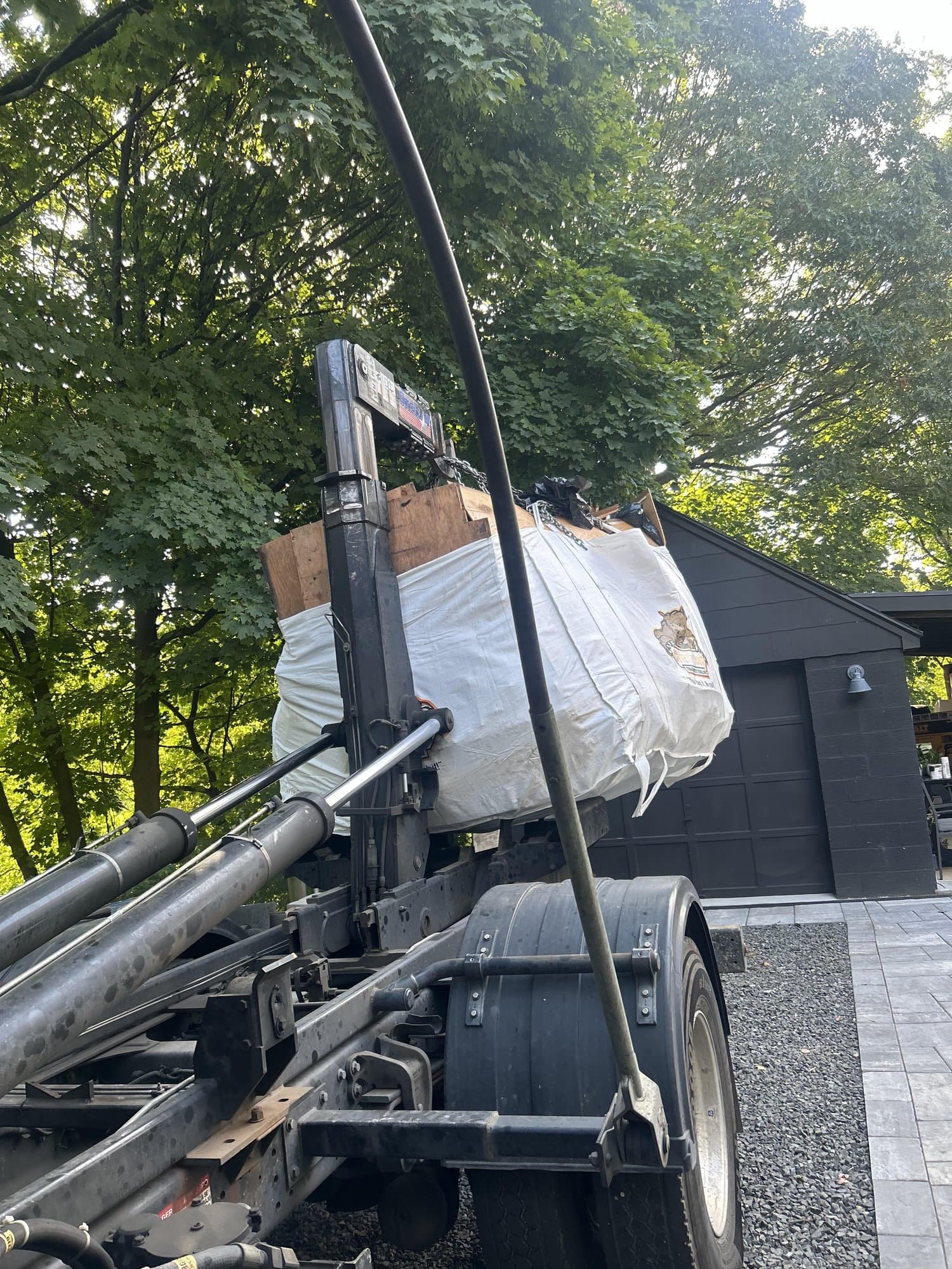 junk removal truck loading by Grizzly Junk Pros
