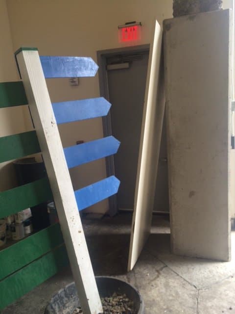 dumpster loading items in Washington, CT by Grizzly Junk Pros