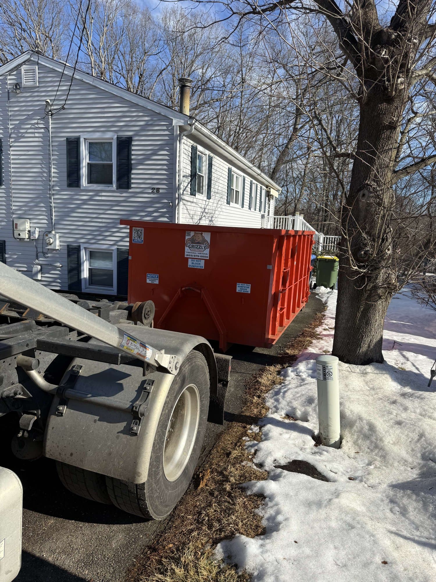 dumpster rental delivery in Waterbury, CT by Grizzly Junk Pros