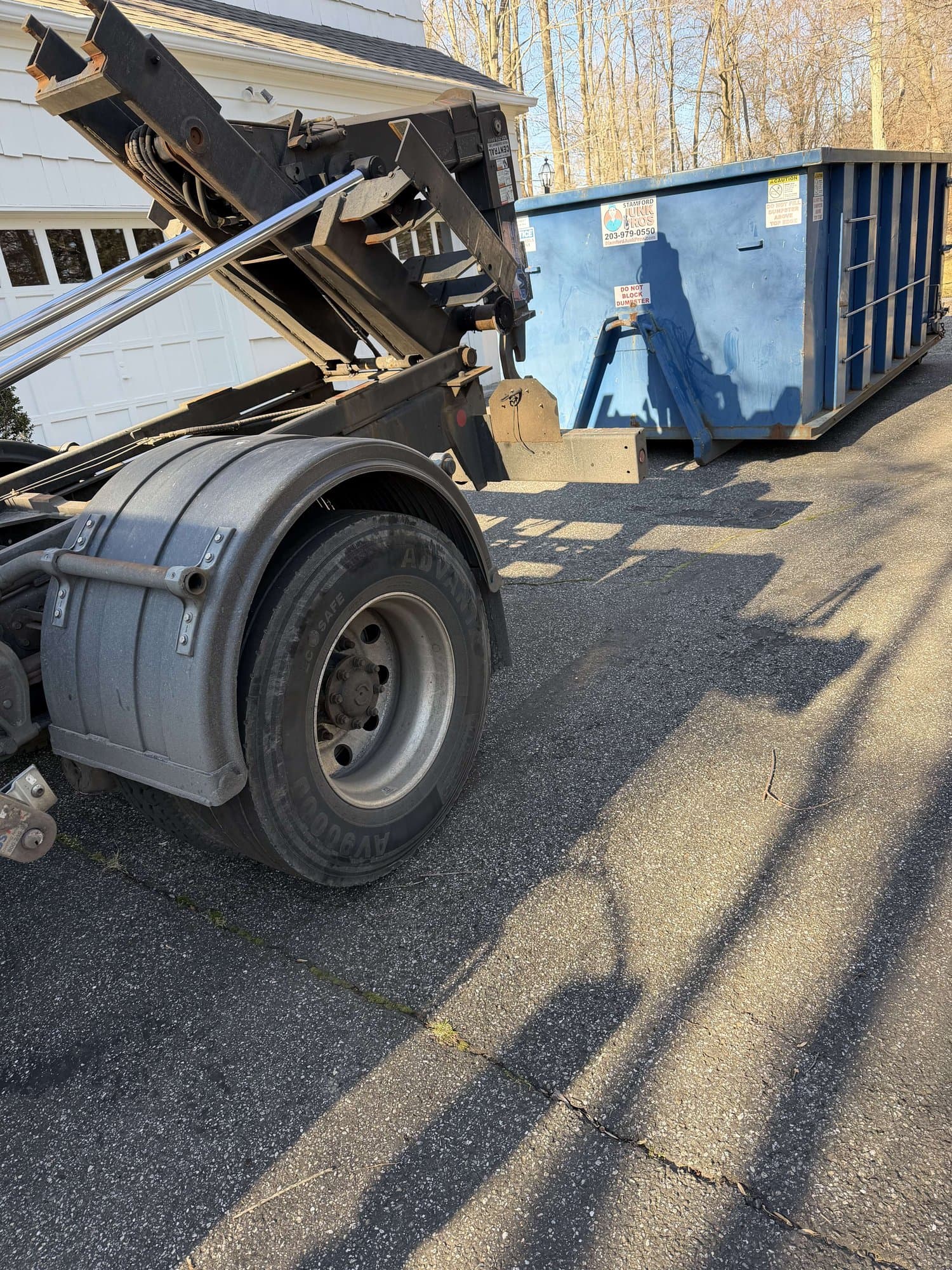 dumpster-truck-loading in Westport, CT by Stamford Junk Pros