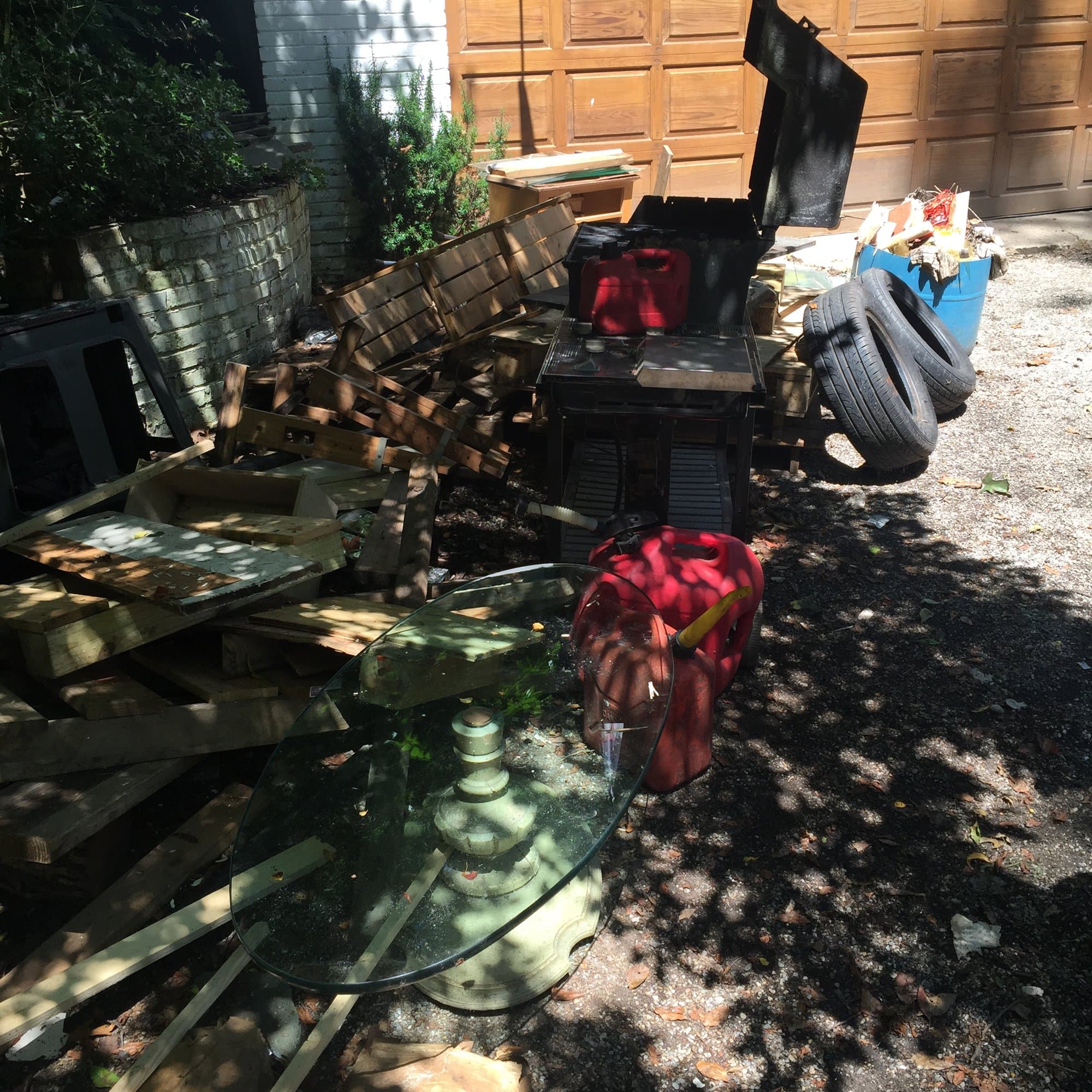 junk-filled-driveway in Wilton, CT by Stamford Junk Pros